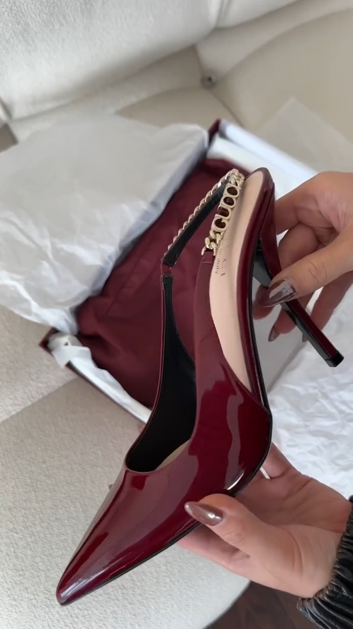 Gucci burgundy patent leather slingback high heels — pointed toe, stiletto heel, slingback strap, gold chain detail on strap
