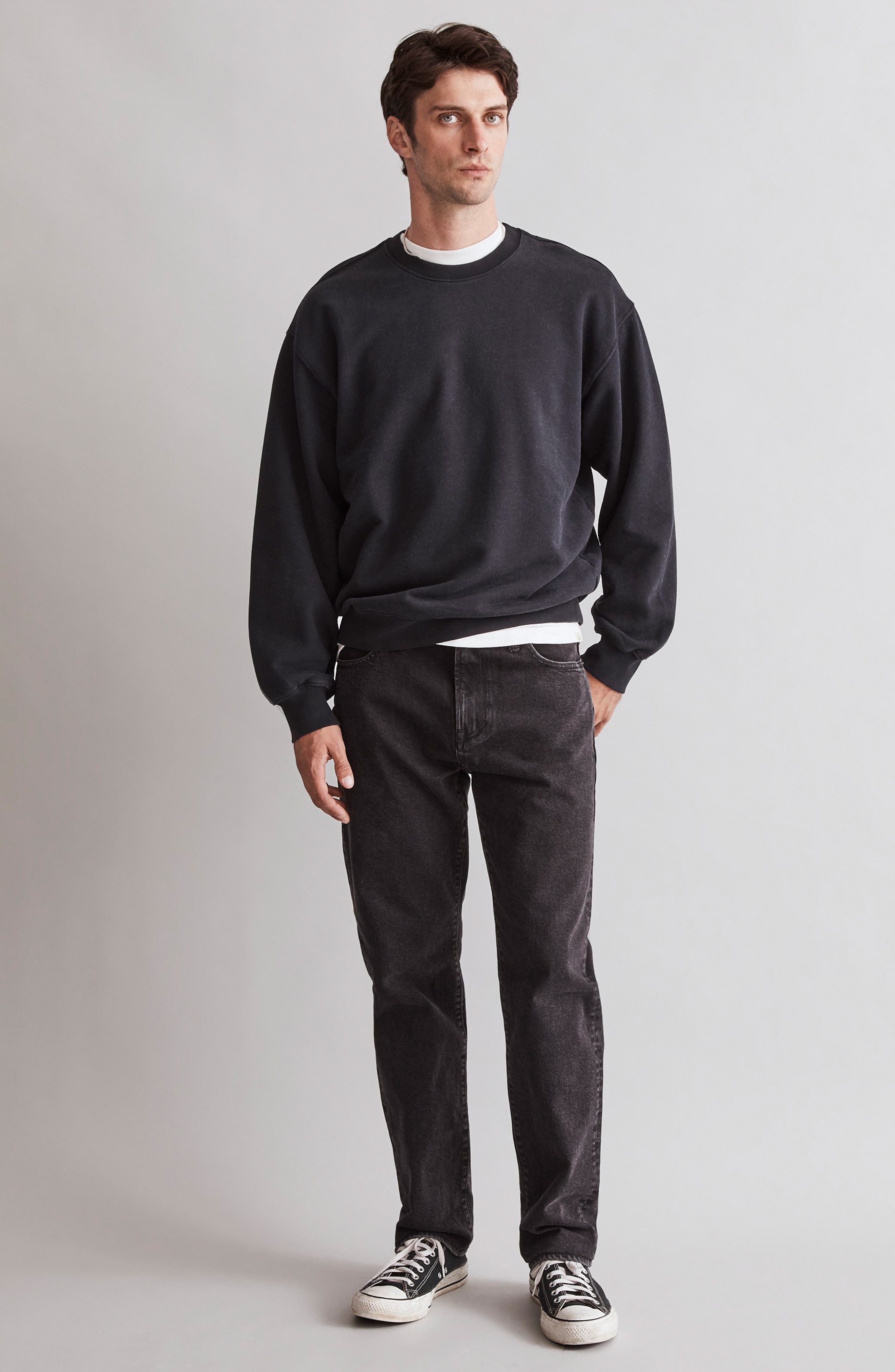 Casual washed black jeans — five-pocket style, button and zipper fly, faded wash effect throughout