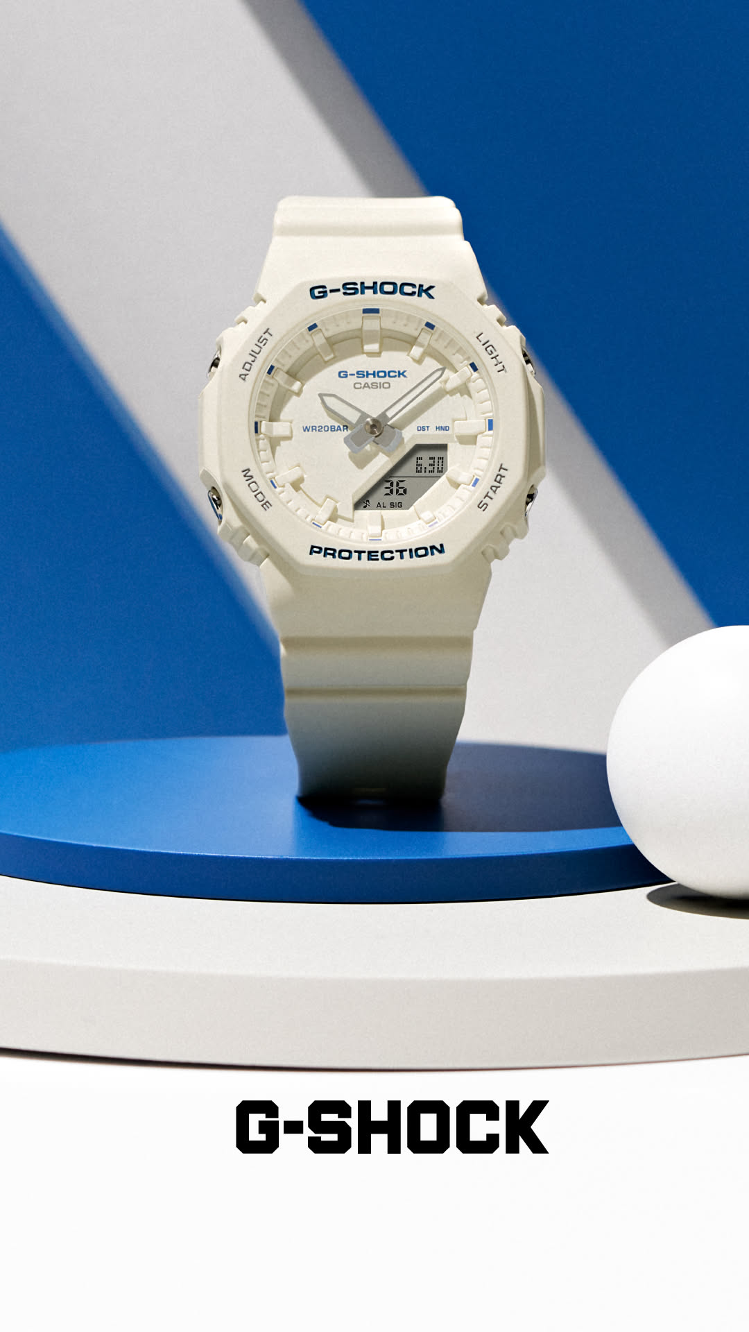 Casio G-Shock off-white watch — octagonal bezel, analog-digital display, four push-buttons, 'G-SHOCK' and 'PROTECTION' branding, 20BAR water resistance