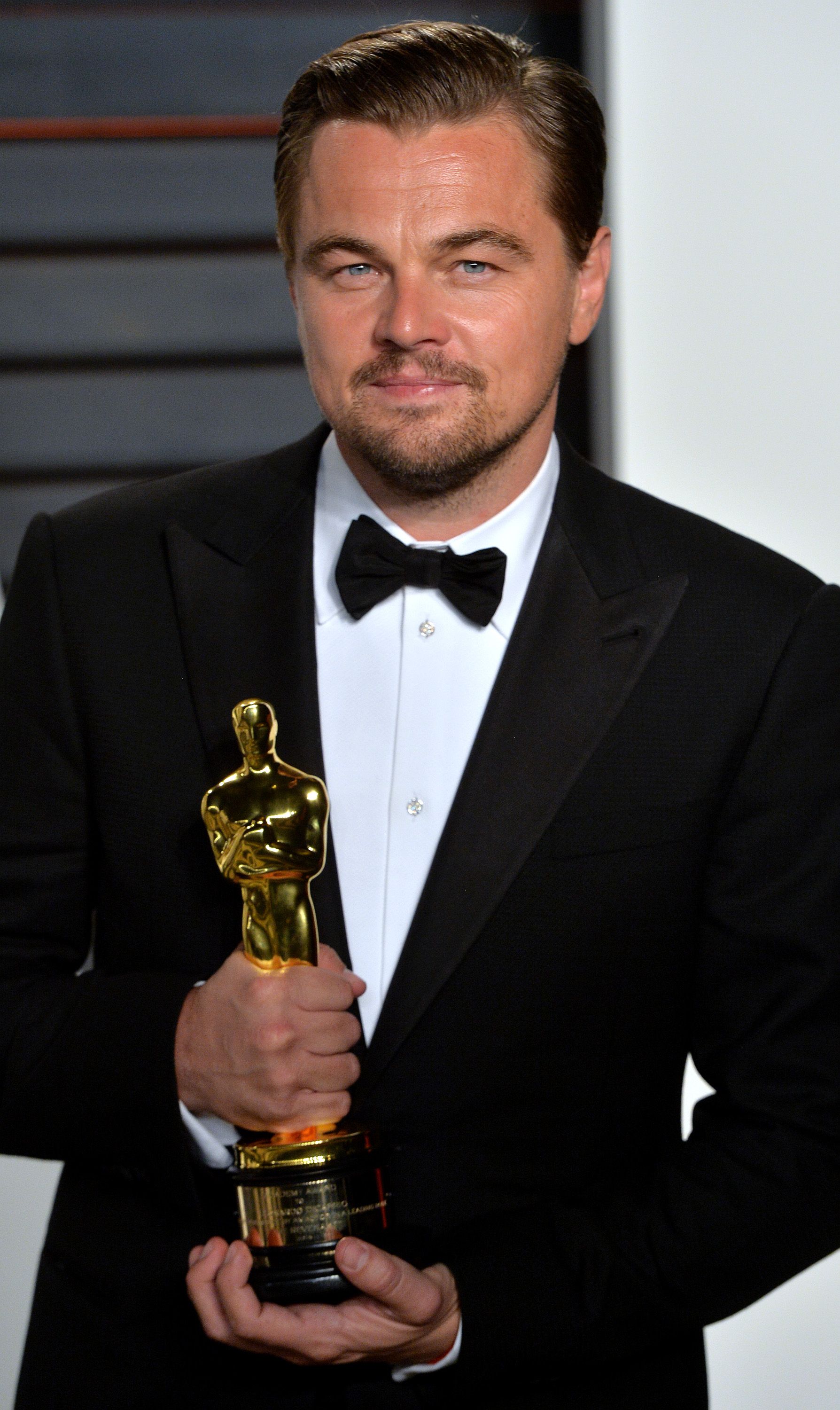 Leonardo DiCaprio black tuxedo jacket — peak lapel, single-breasted, single-button closure, jetted pockets