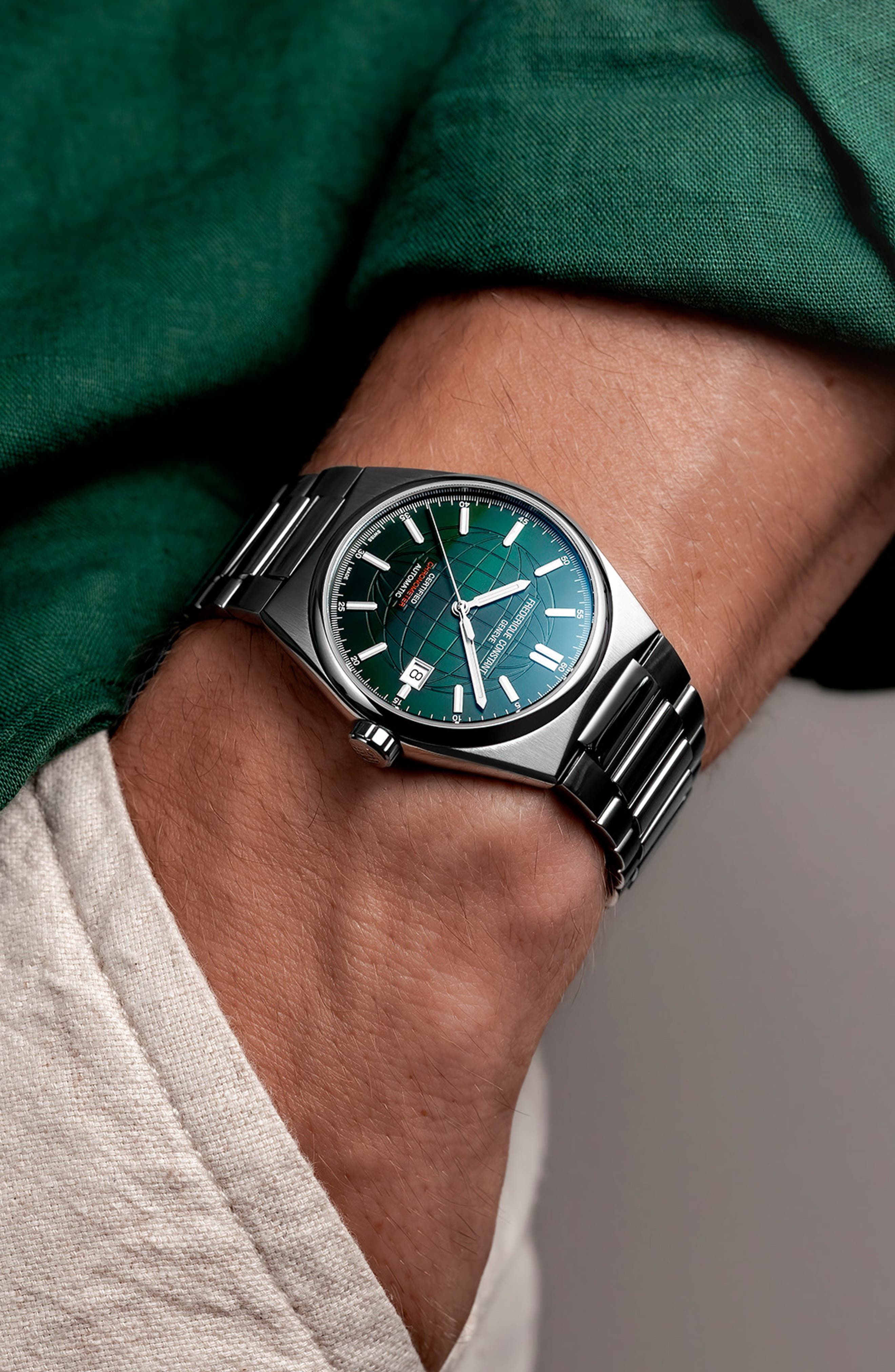 Frederique Constant silver-tone with green dial wristwatch — integrated bracelet, faceted case, green globe pattern dial, date window, applied indices, chronometer certified
