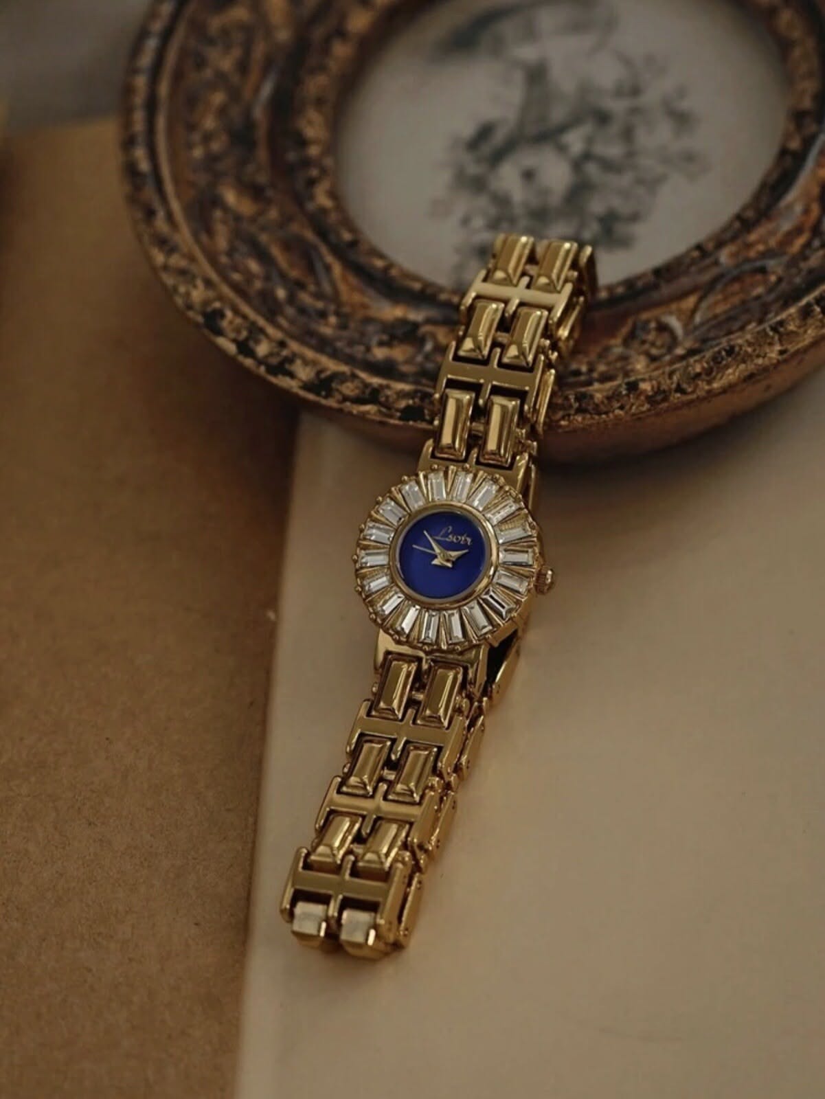 Leotr Gold-tone and Deep Blue Watch — Baguette Crystal Bezel, Round