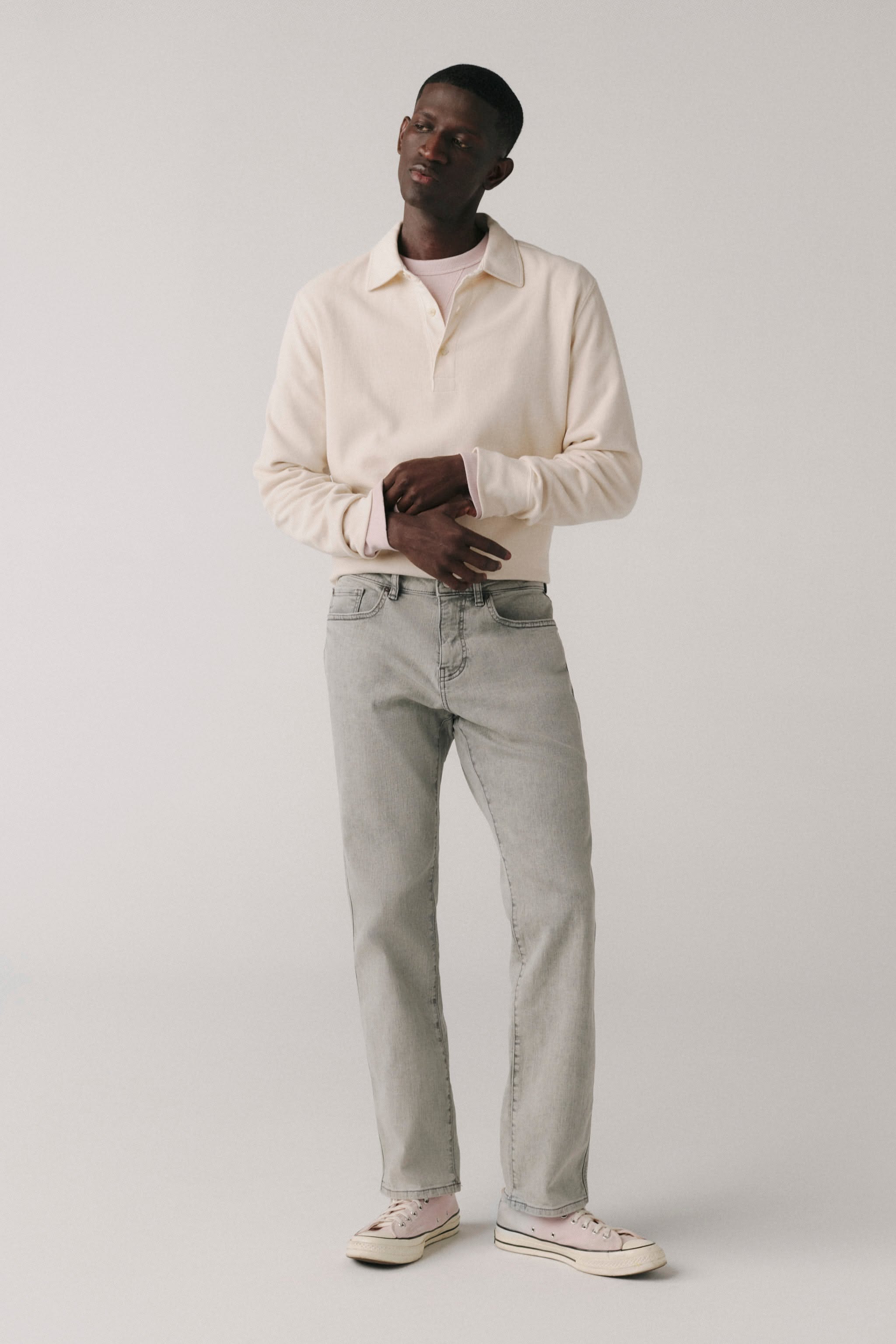 casual light grey wash jeans — five-pocket style, subtle whiskering, light fading