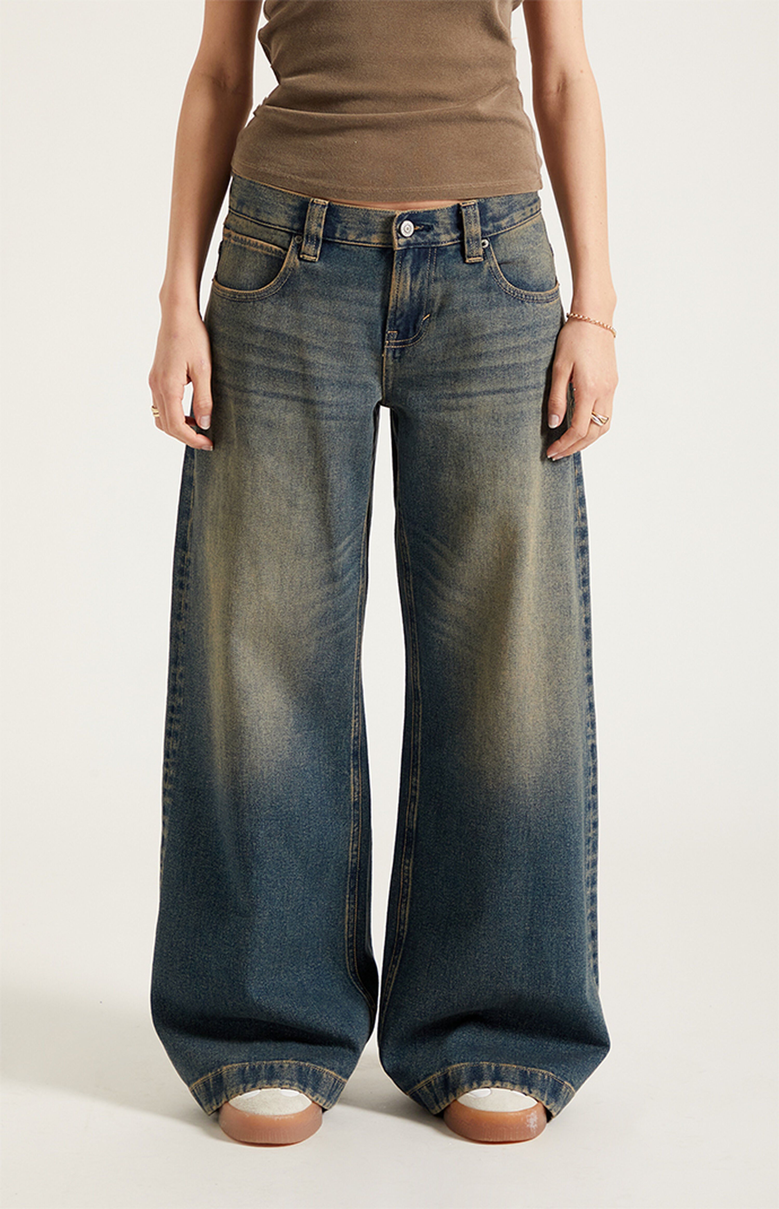 casual dark wash blue denim with faded yellow tint jeans — wide leg, distressed wash, classic five-pocket styling, belt loops