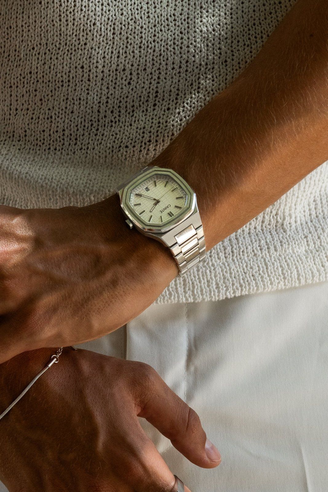 CAINTE silver-toned with champagne dial watch — octagonal bezel, integrated bracelet, textured dial, Roman numeral hour markers, date window at 3 o'clock
