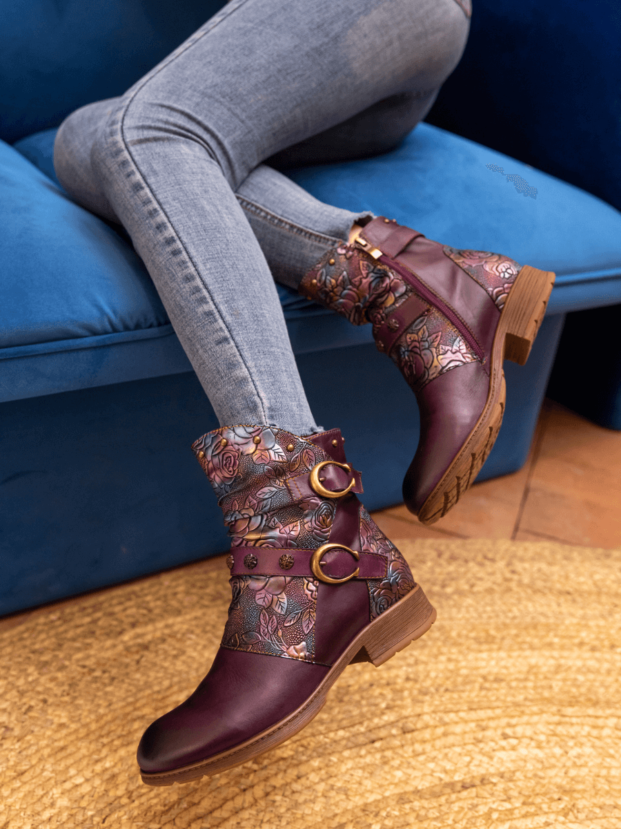 bohemian burgundy ankle boots — embossed floral pattern, buckle straps, gold-tone hardware, rivet studs, side zipper
