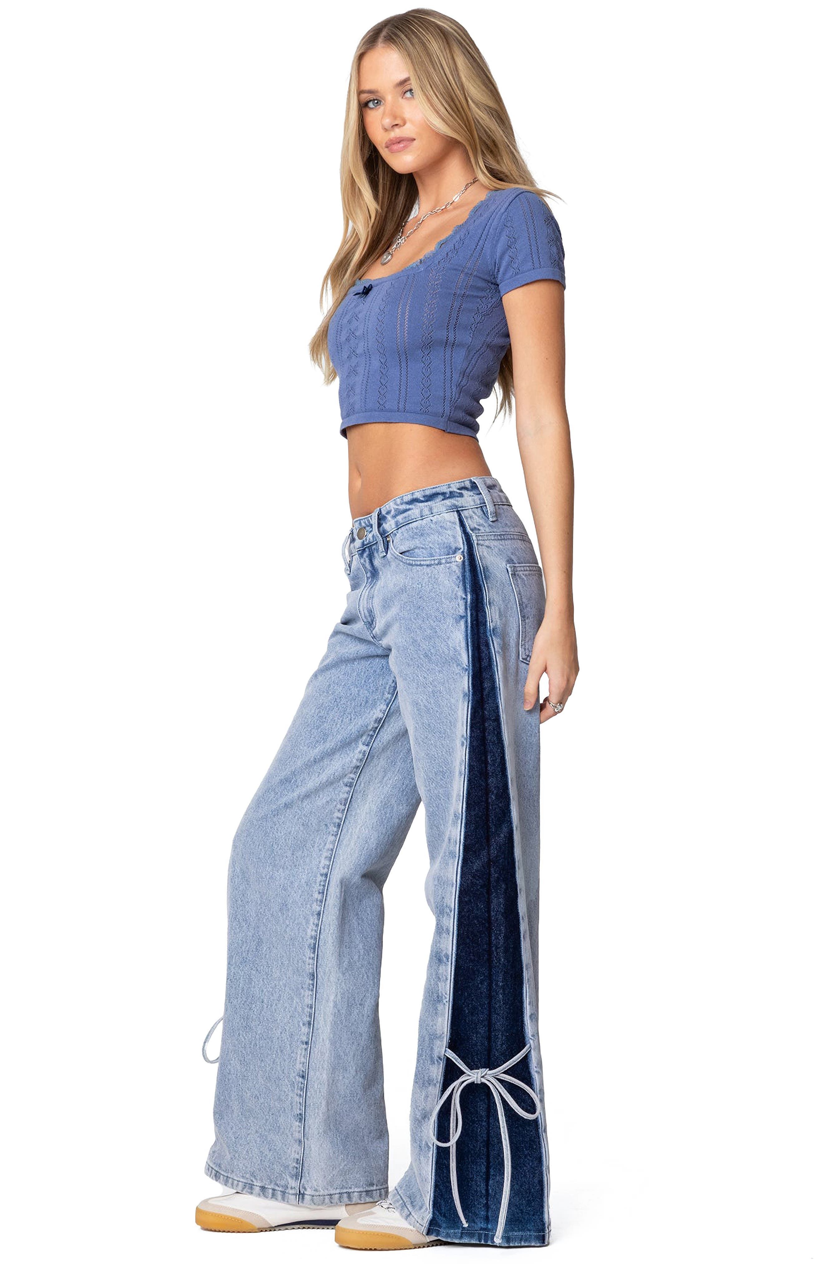Y2k light wash blue with dark wash blue panels jeans — contrast side panels in dark wash denim, lace-up detail at the hem of the side panels, distressed wash