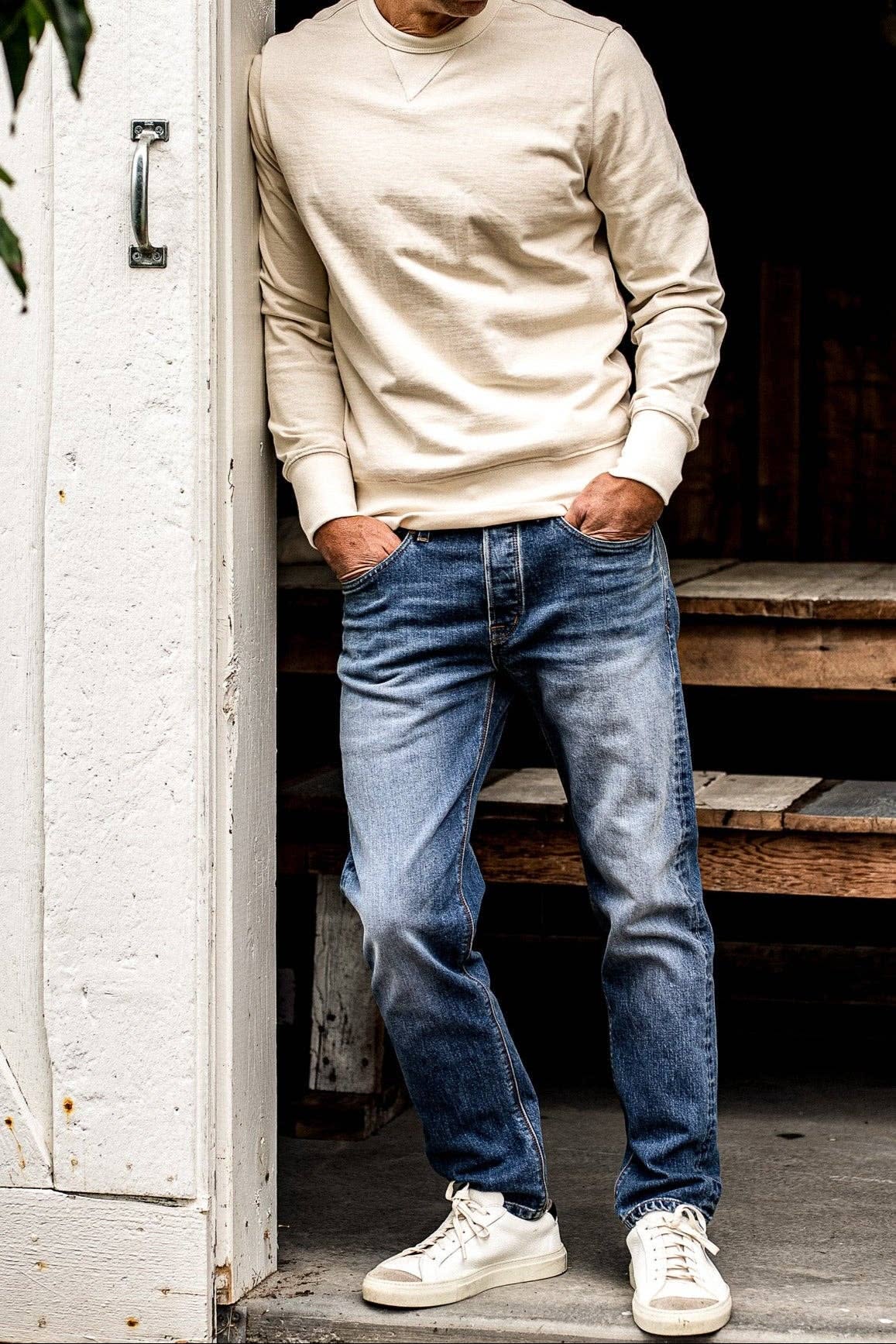 casual medium blue wash jeans — fading and whiskering, button fly, traditional five-pocket style