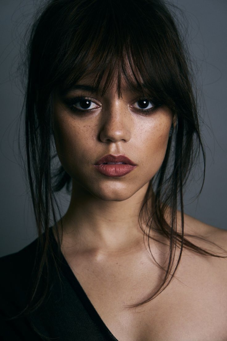 Jenna Ortega black top — v-neck, off-shoulder style