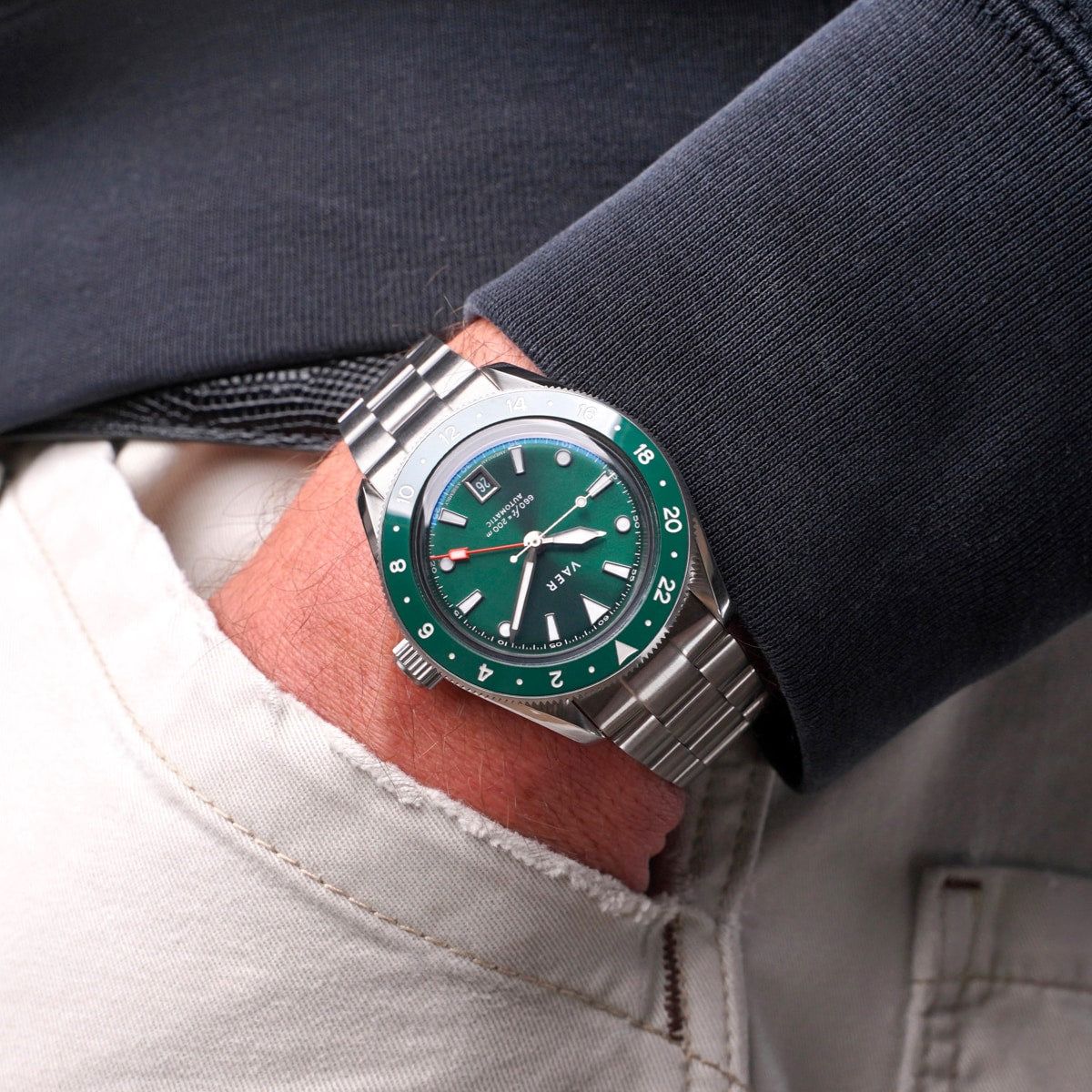 VAER green dial, silver bracelet wristwatch — GMT function, rotating bezel, date window, luminous hands and markers, screw-down crown