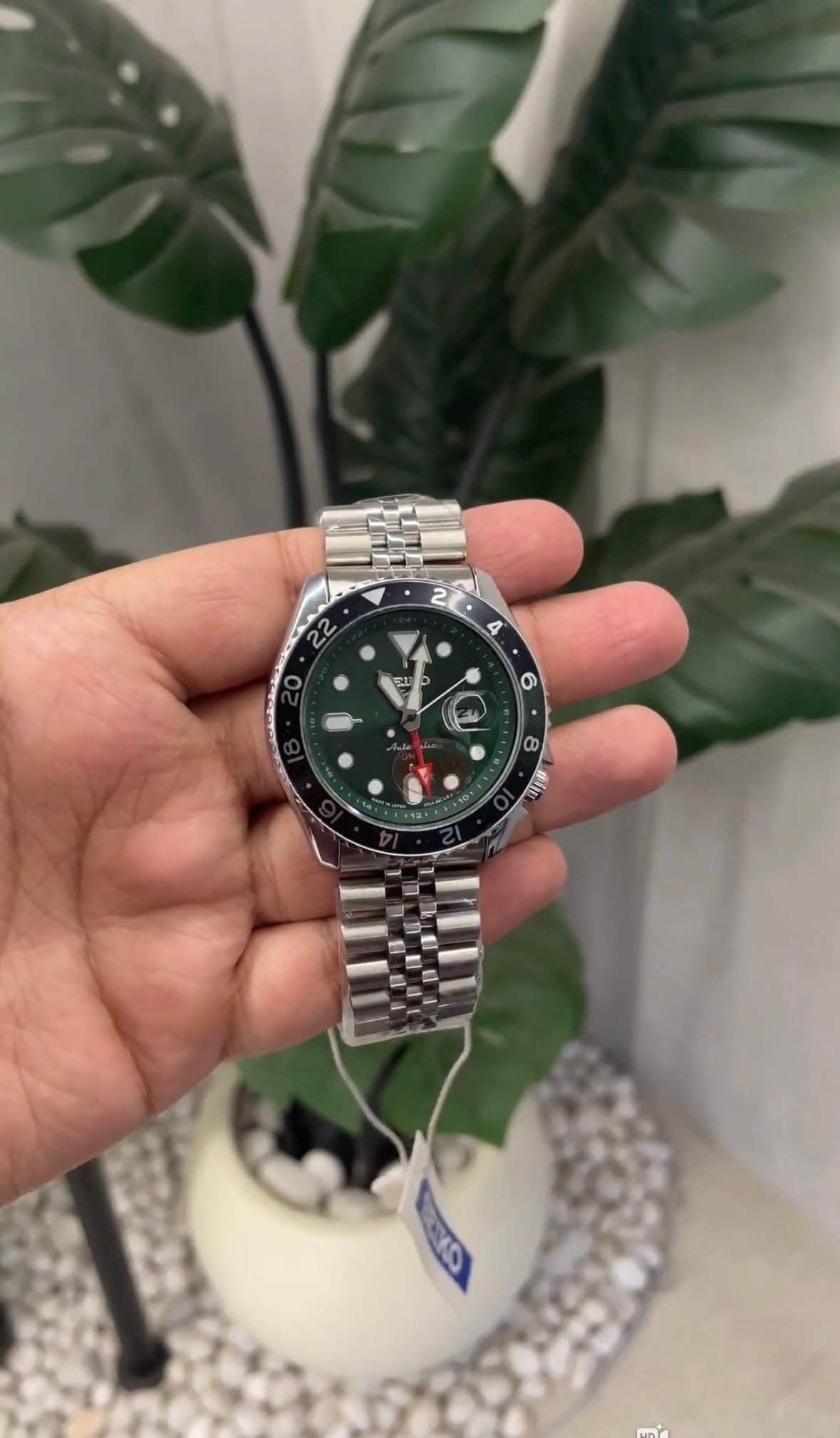 Seiko green dial, black and silver bezel, silver bracelet wrist watch — GMT function, rotating bezel with 24-hour markers, luminous hour markers and hands, date window, jubilee bracelet
