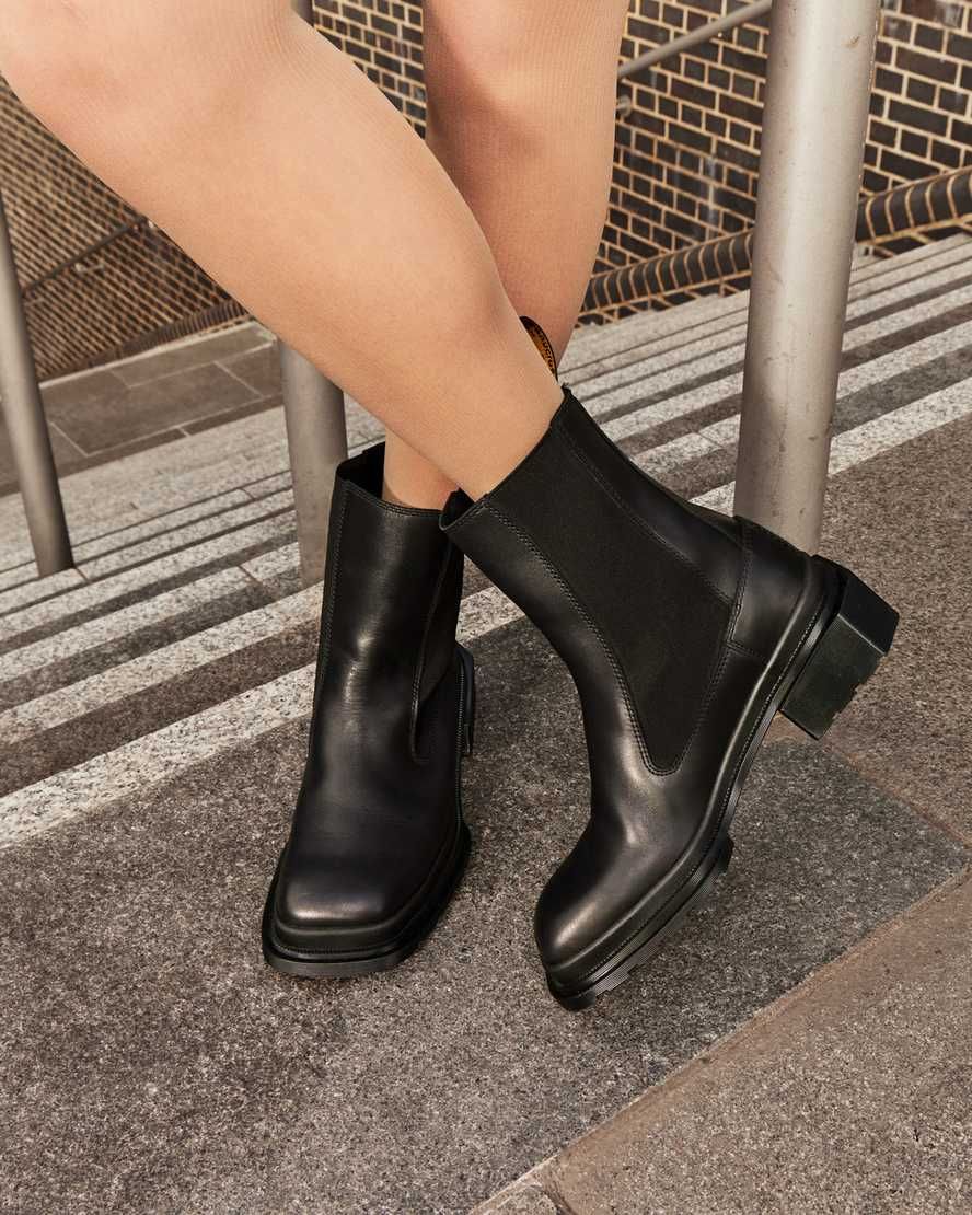 Dr. Martens black Chelsea boots — square toe, elastic side panels, pull tab, chunky block heel, lug sole