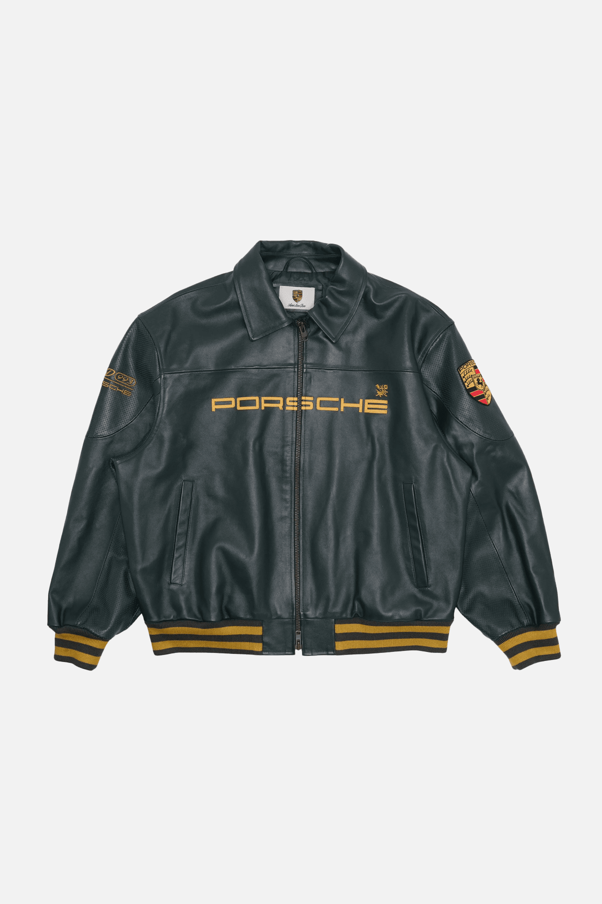 Porsche Design dark forest green bomber jacket — collared neckline, full zip closure, ribbed cuffs and hem with yellow stripes, embroidered 'PORSCHE' text on chest, embroidered Porsche crests on sleeve and back, per