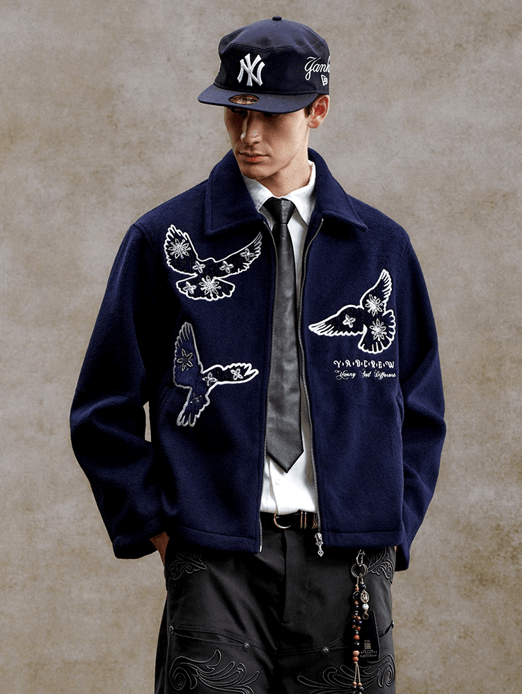 streetwear navy blue casual jacket — white embroidered dove and floral motifs, spread collar, full zip closure, ribbed hem and cuffs, white text embroidery