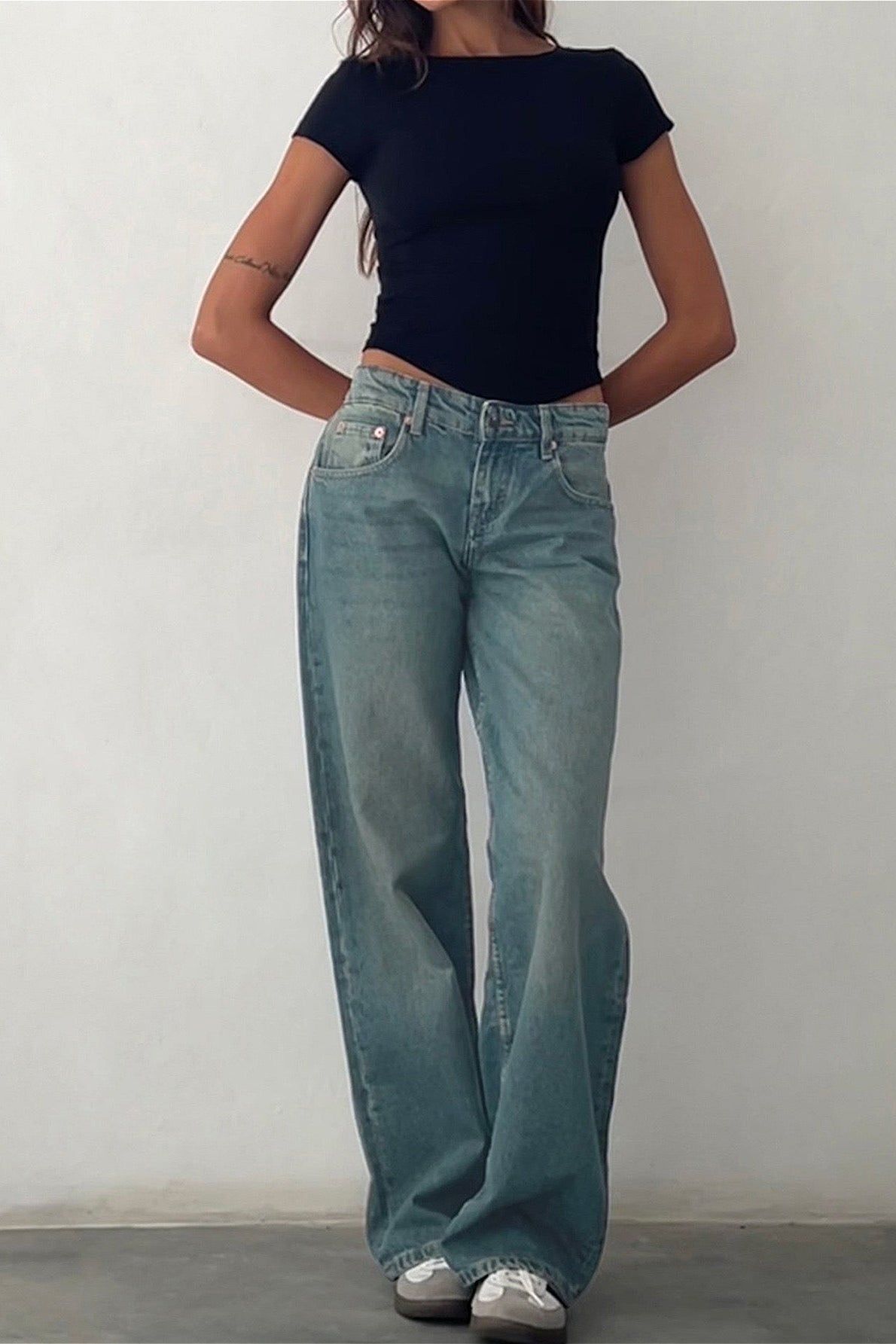 casual light wash blue jeans — low rise, five-pocket style, faded wash