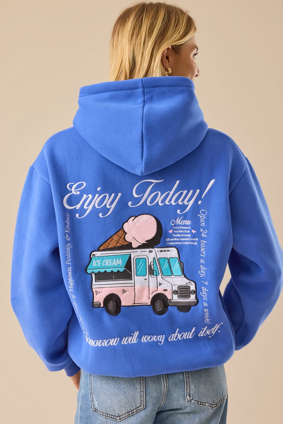 casual royal blue hoodie — drawstring-less hood, ribbed cuffs and hem, large back graphic print featuring an ice cream truck and text