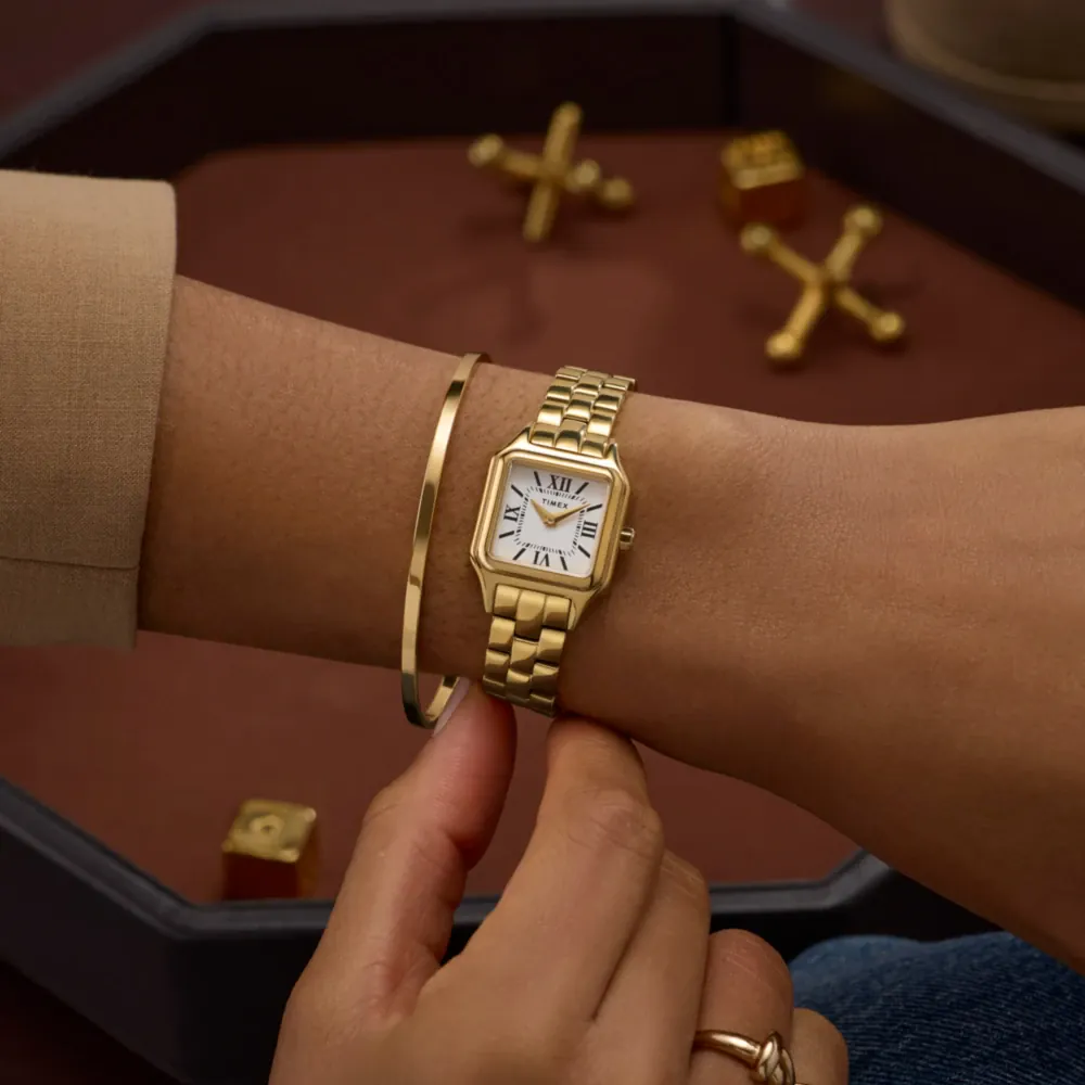 Timex gold watch — square case, white dial, Roman numerals, link bracelet, three-hand movement