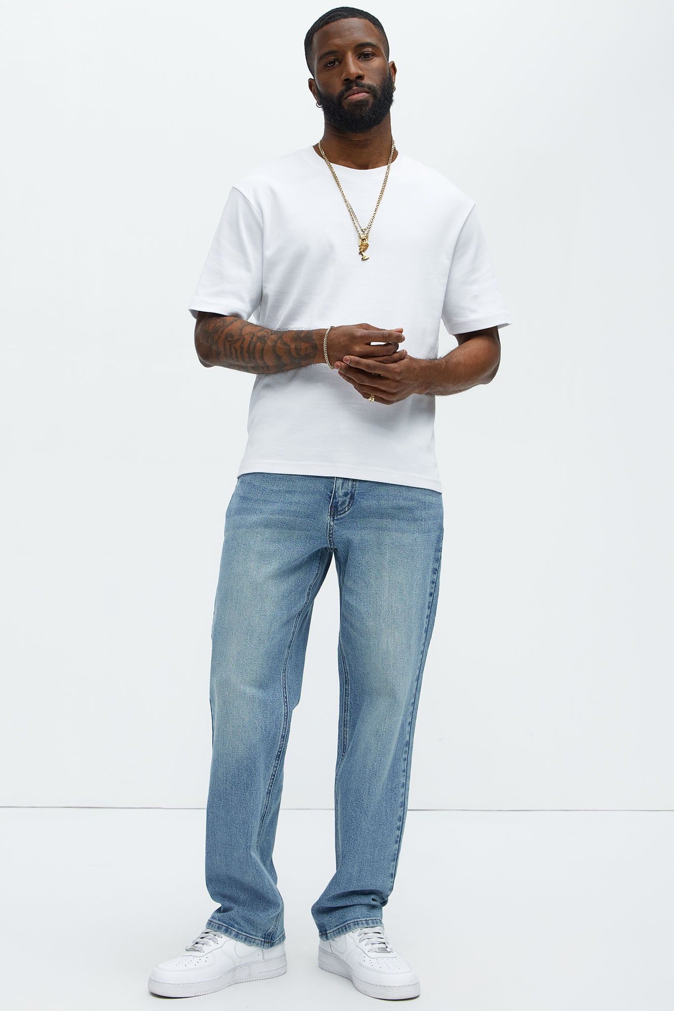 casual light wash blue jeans — faded wash, classic five-pocket style