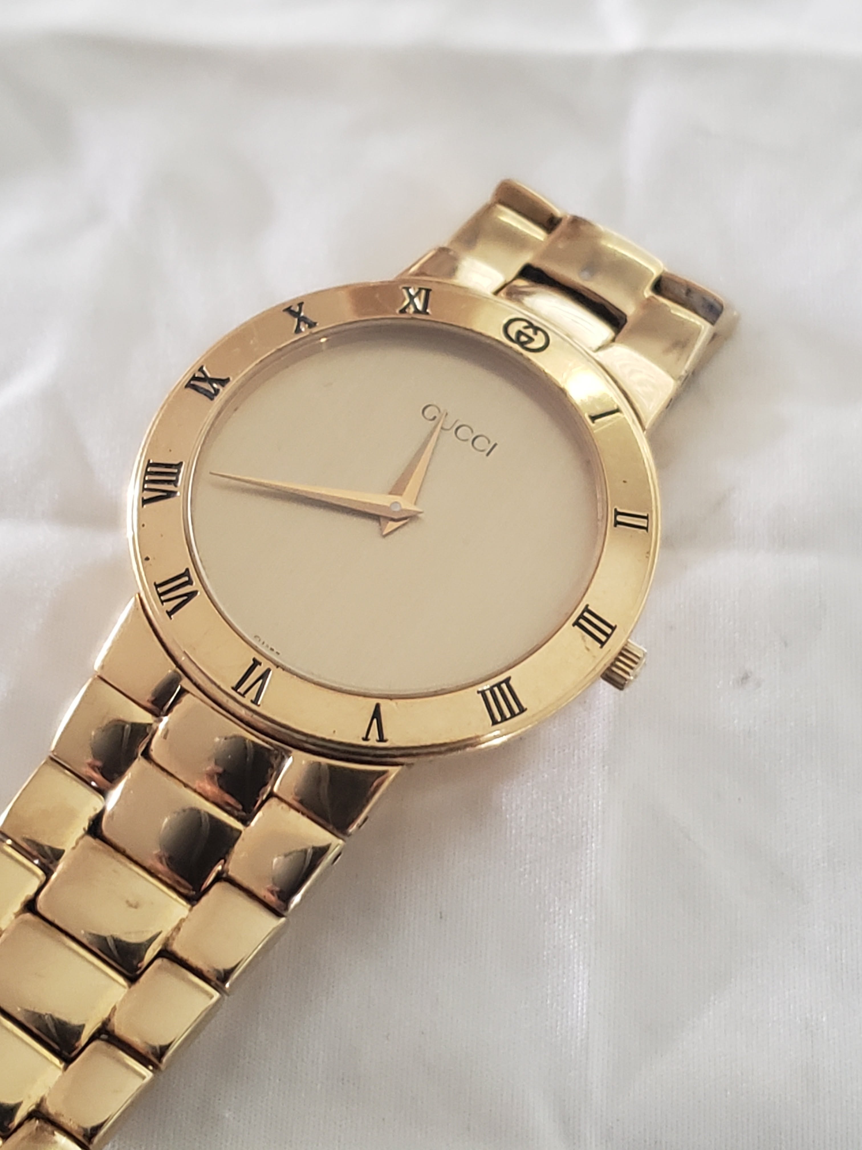 Gucci Gold Watch — Cream Dial, Roman Numeral Hour Markers, Two-hand