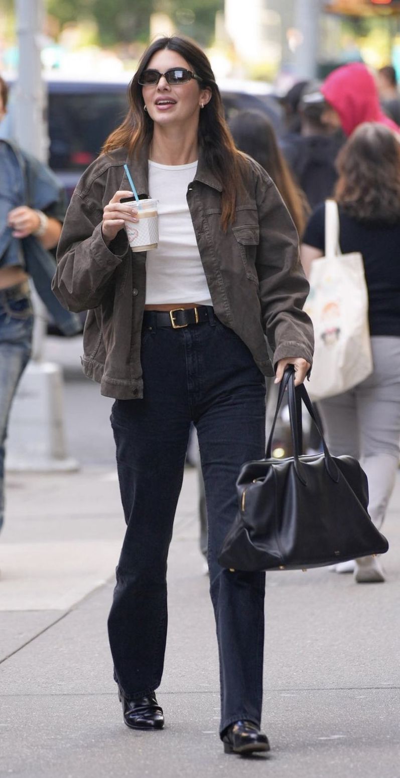 Kendall Jenner dark olive green utility jacket — collared, button-front, flap chest pockets, long sleeves with button cuffs