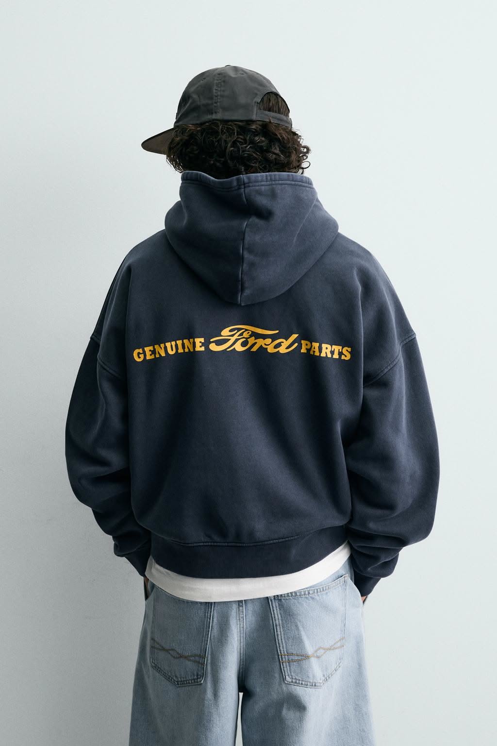 Ford (licensed merchandise) washed navy blue hoodie — hood with drawstrings, ribbed cuffs and hem, 'GENUINE Ford PARTS' graphic print in yellow on the back
