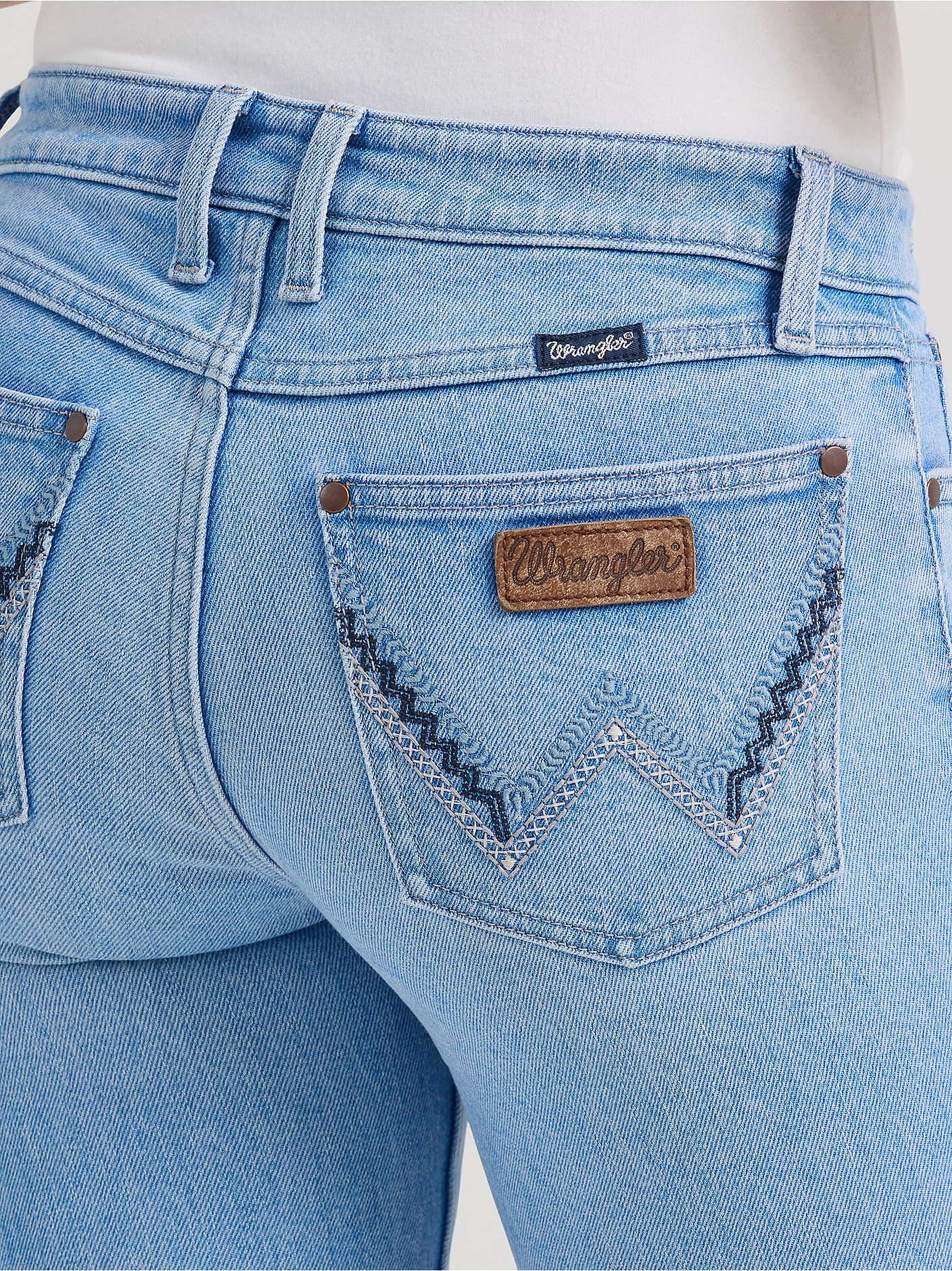 Wrangler Light Wash Blue Jeans — Wrangler 'w' Stitching on Back