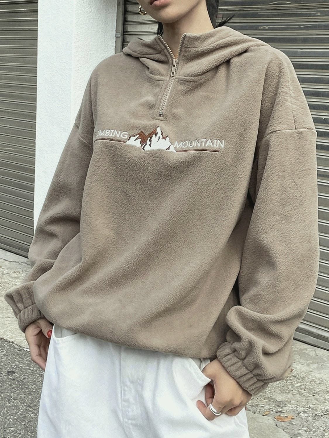 casual taupe hoodie — quarter-zip, hood, dropped shoulders, ribbed cuffs, mountain graphic embroidery