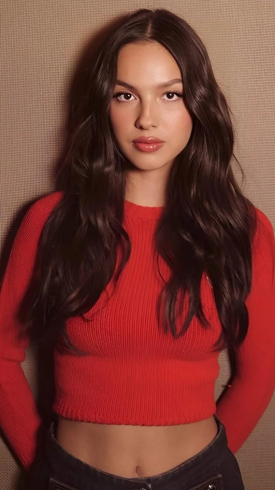 Olivia Rodrigo vibrant red crop top — crew neck, long sleeve, ribbed texture, elasticated hem