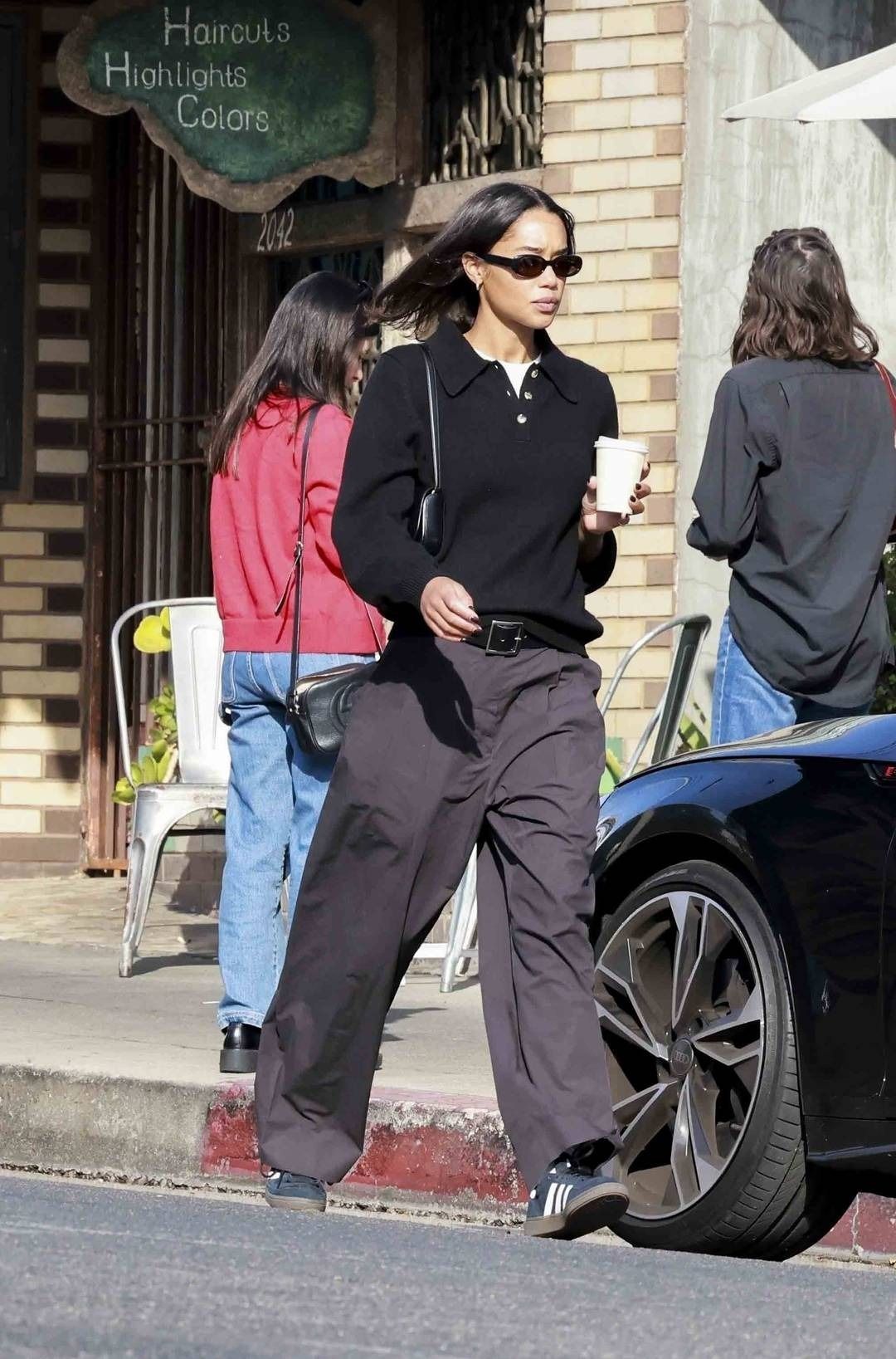 Zoë Kravitz Black Polo Sweater — Collared Neckline, Button Placket
