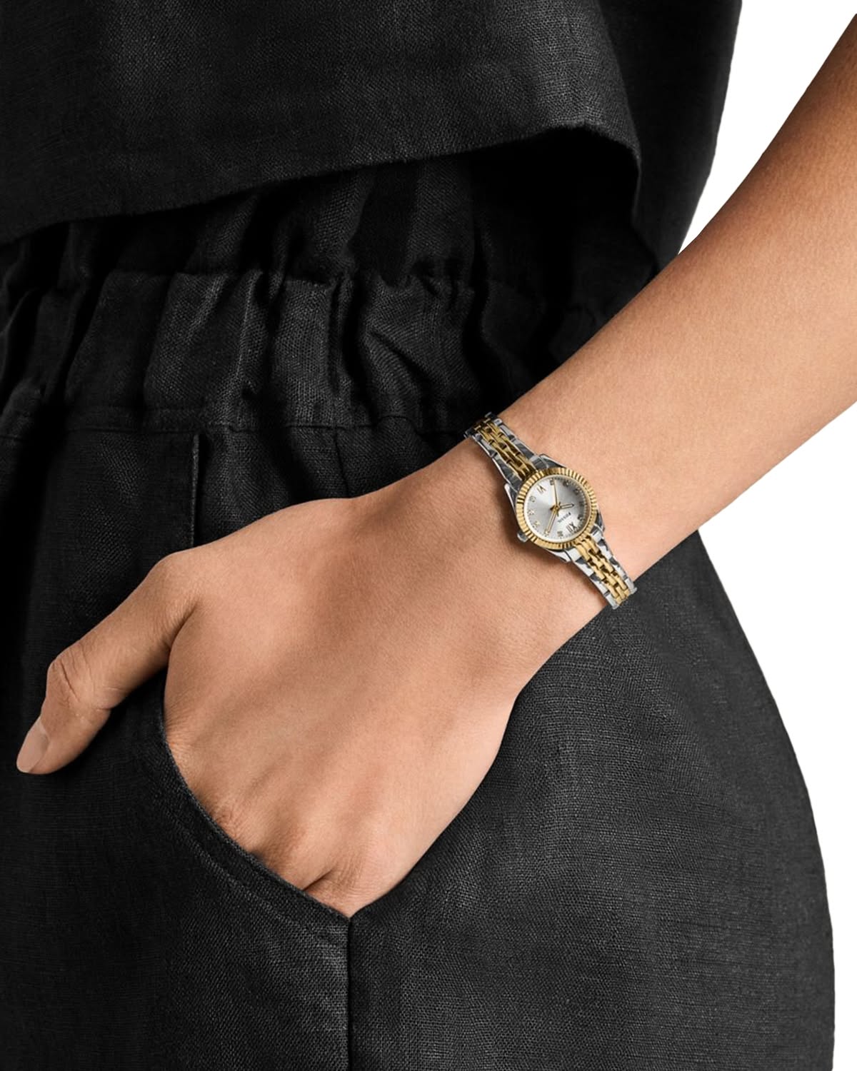 Fossil two-tone silver gold wristwatch — round fluted bezel, jubilee bracelet, Roman numeral indices, champagne dial