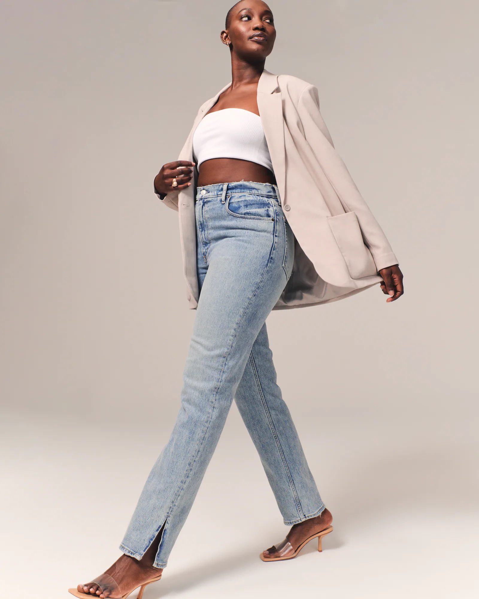 casual light wash blue denim straight leg jeans — ultra high rise, straight leg, subtle whiskering, split hem ankle