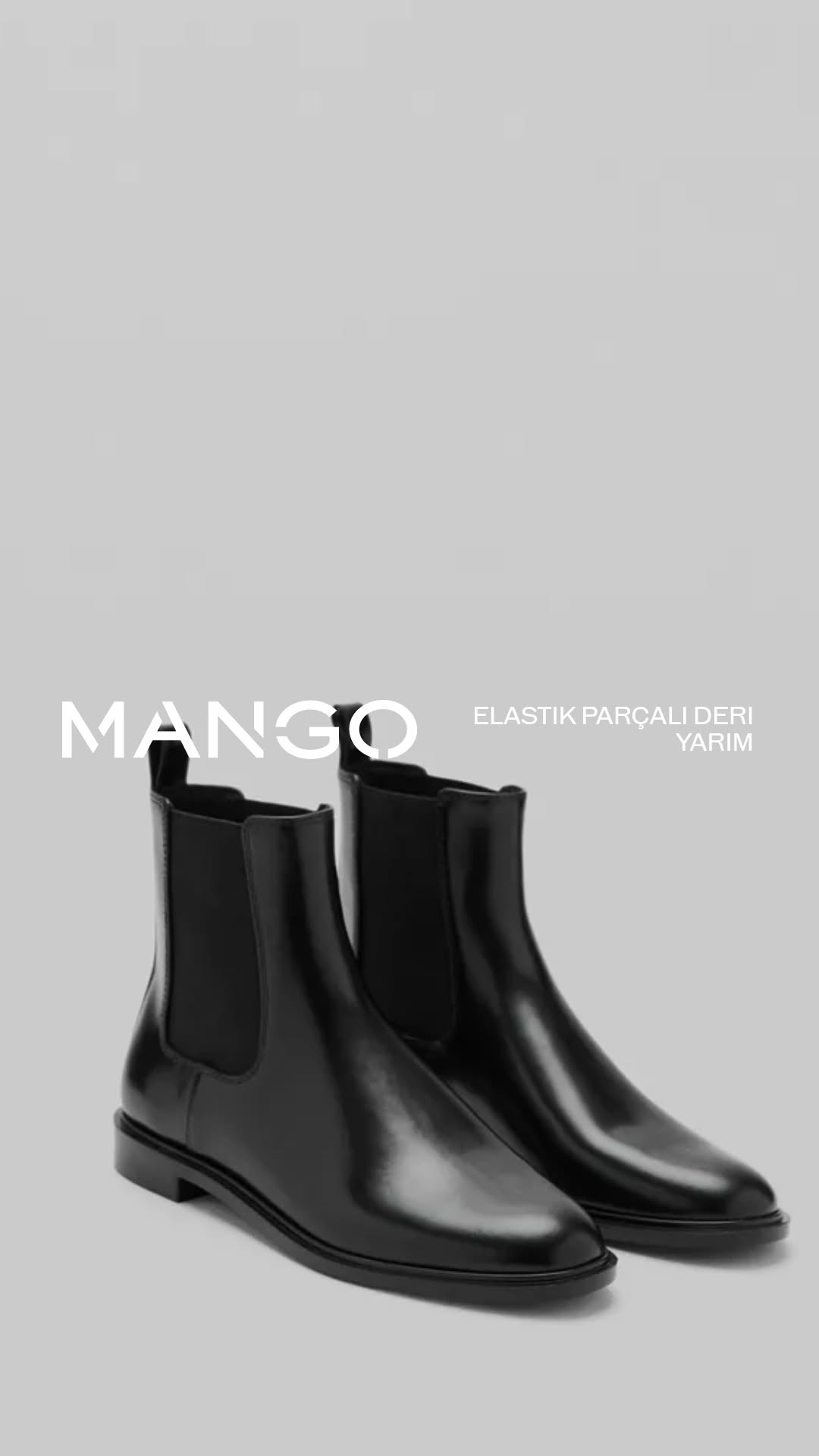 Mango black ankle boots — Chelsea boot style with elastic side panels, rounded toe, and low block heel