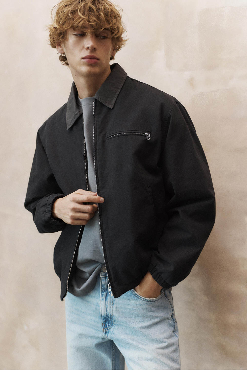 Casual charcoal grey jacket — pointed collar, full zip closure, single zippered chest pocket, elasticated cuffs and hem