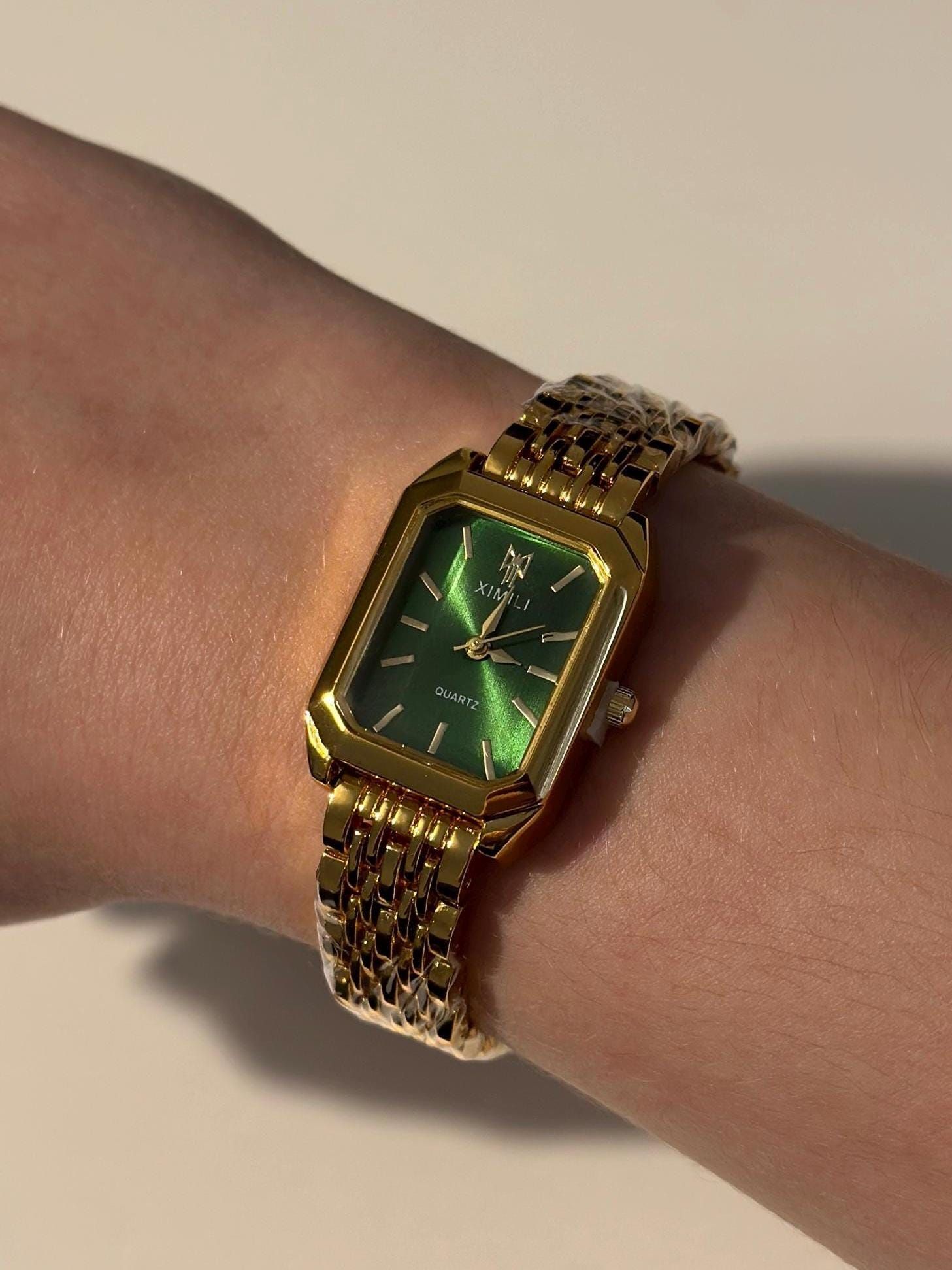 XIMILI gold wrist watch — rectangular case, emerald green dial, gold tone index hour markers, link bracelet, quartz movement