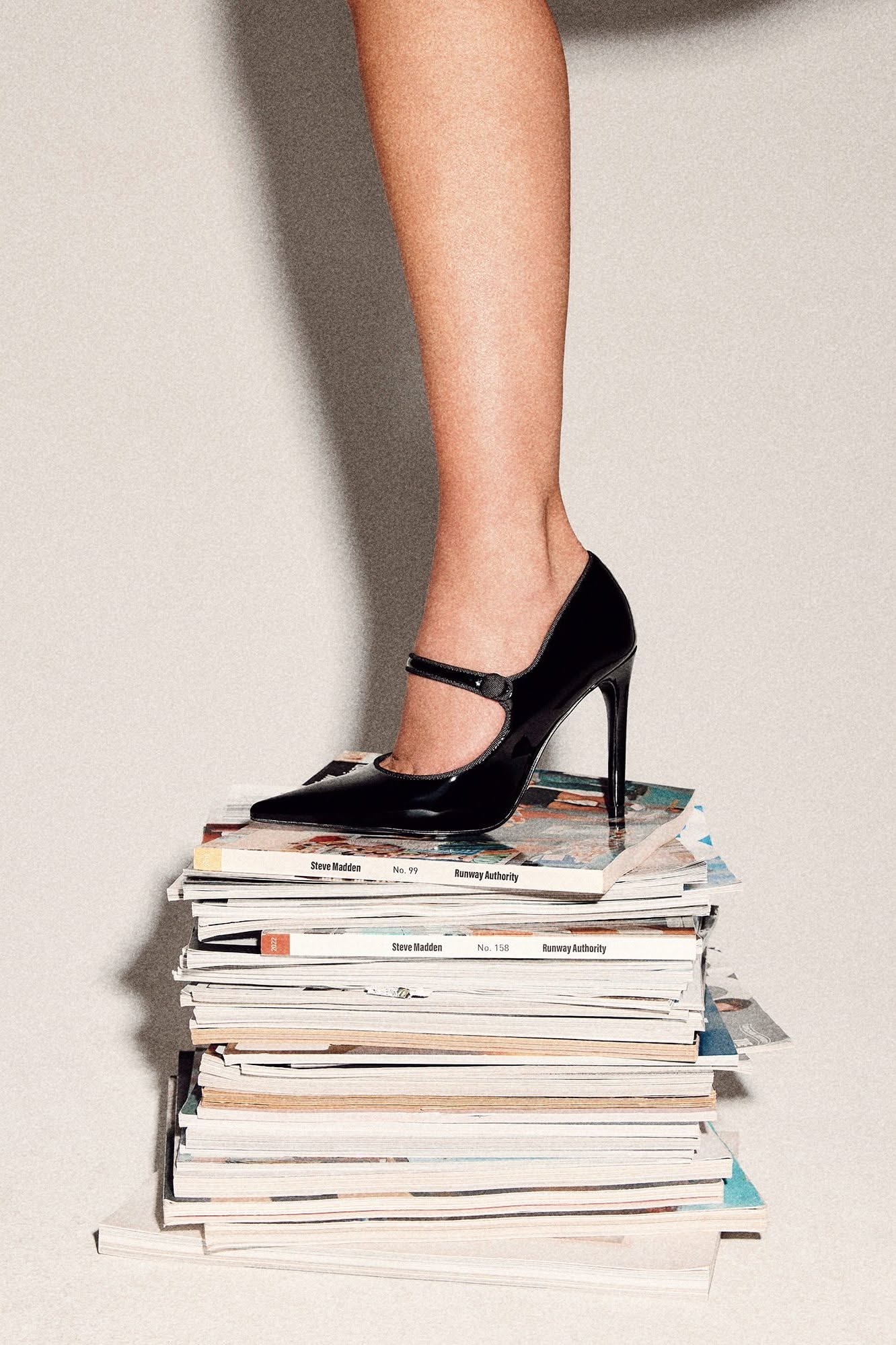 Steve Madden black patent Mary Jane pump — pointed toe, stiletto heel, single strap with button closure, scalloped trim