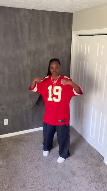 streetwear red and yellow sports jersey — V-neck, short sleeves with striped cuffs, large number '19' on front, white and yellow trim