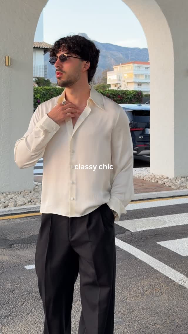 casual cream button-up shirt — long point collar, full button placket, long sleeves with buttoned cuffs, slightly oversized