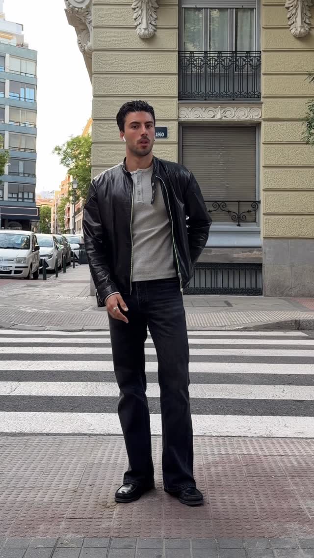 casual black leather jacket — front zipper closure, ribbed collar, long sleeves with ribbed cuffs