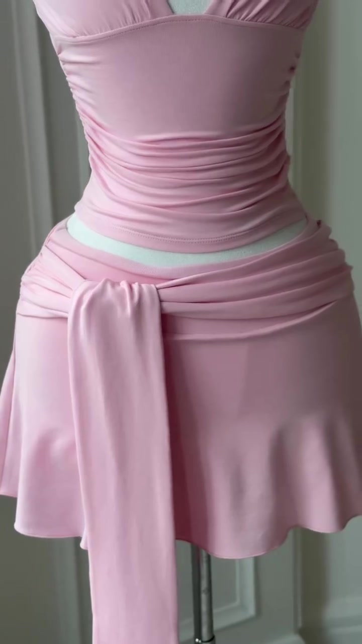 casual light pink two-piece set — ruched bodice, halter neckline, tie-waist wrap skirt, flounce hem