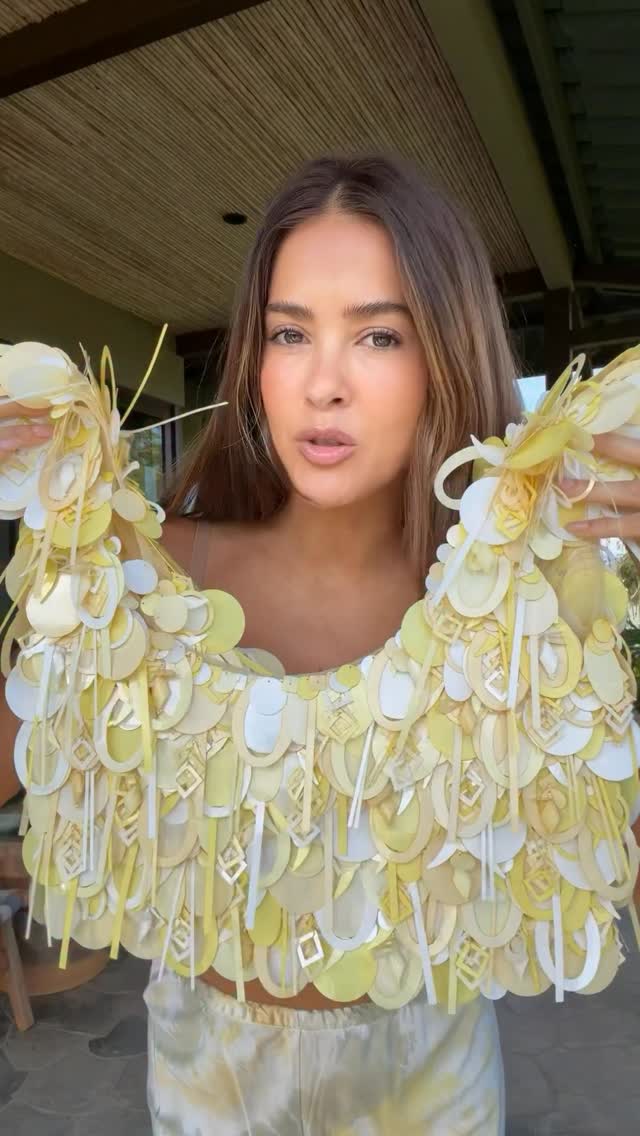 avant-garde shades of yellow and white statement top — scalloped edges, layered cutouts, geometric shapes, fringe-like details