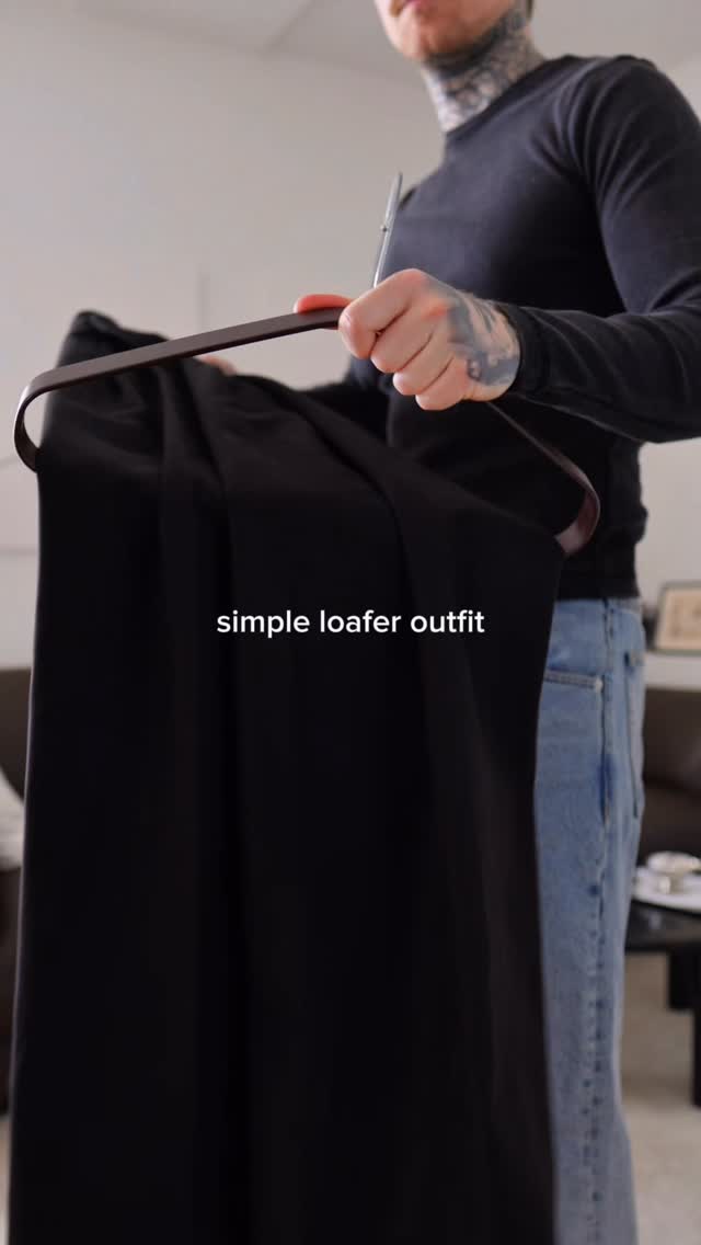 minimalist black trousers — pleated front, relaxed fit