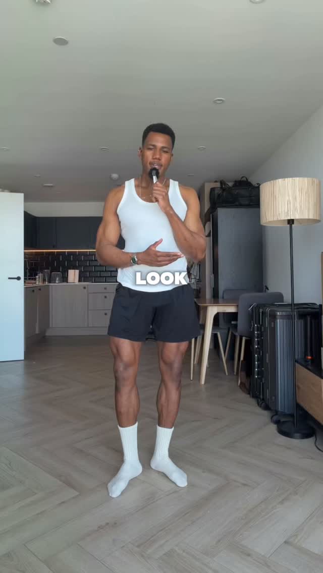 casual white and black tank top and shorts outfit — ribbed tank top, elastic waist shorts, above-knee length shorts