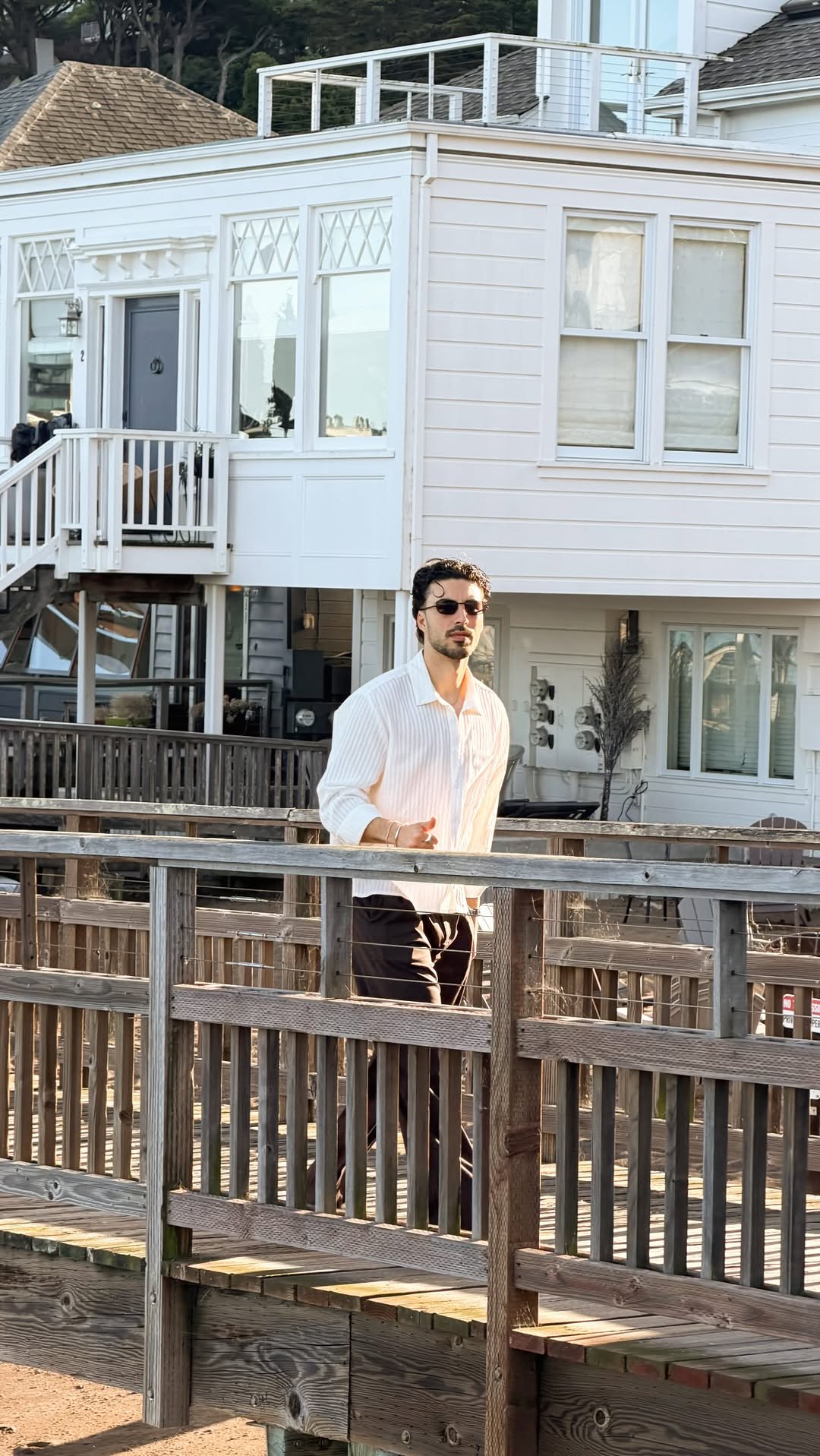 casual off-white button-up shirt — collared, long sleeve, button-front, subtle vertical stripes