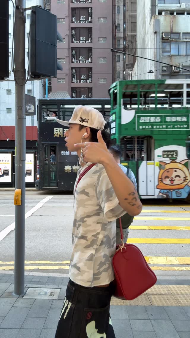 streetwear white and grey camouflage top, black and light green graphic jeans t-shirt and jeans outfit — crew neck t-shirt, short sleeves, wide leg jeans, graphic print on jeans