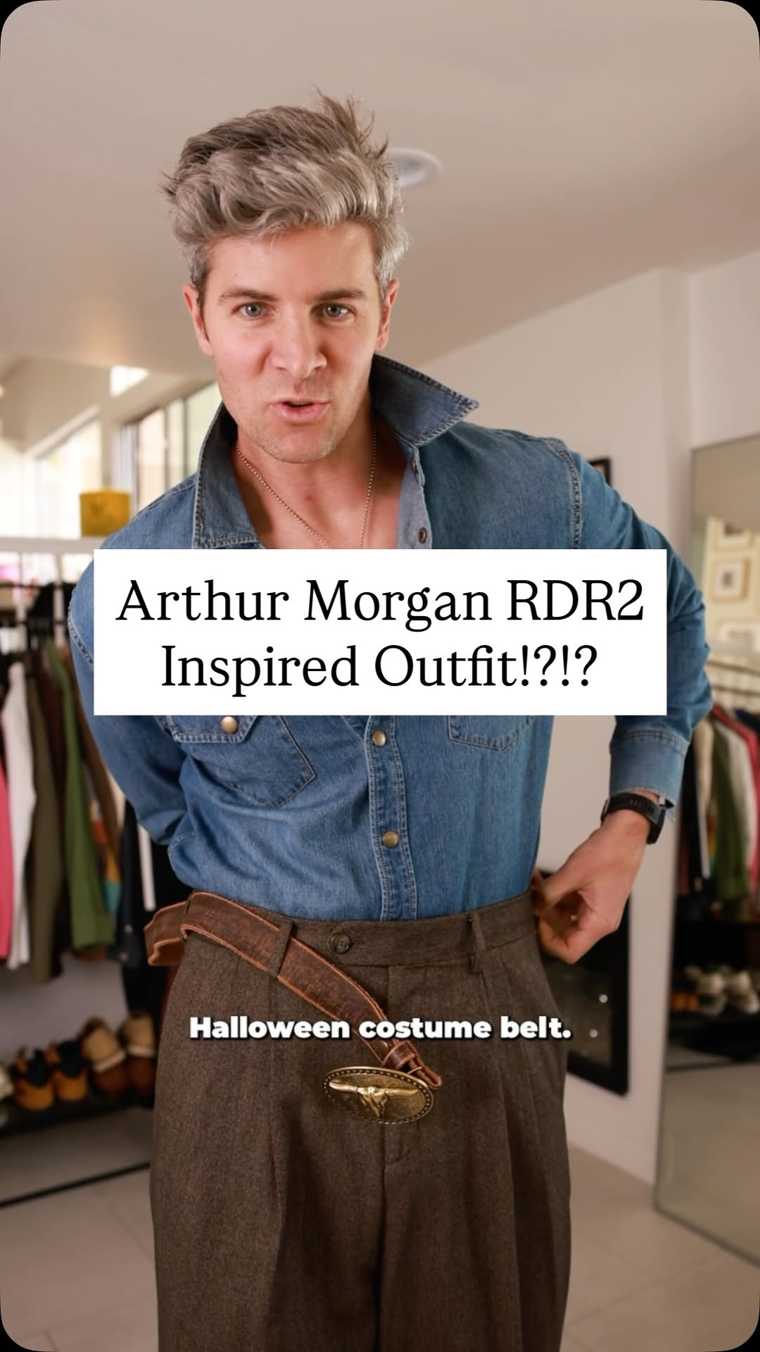 western, casual medium wash blue, dark brown western outfit — snap buttons, chest pockets, pointed collar (shirt); pleated front, wide leg (trousers); large buckle with steer head motif (belt)