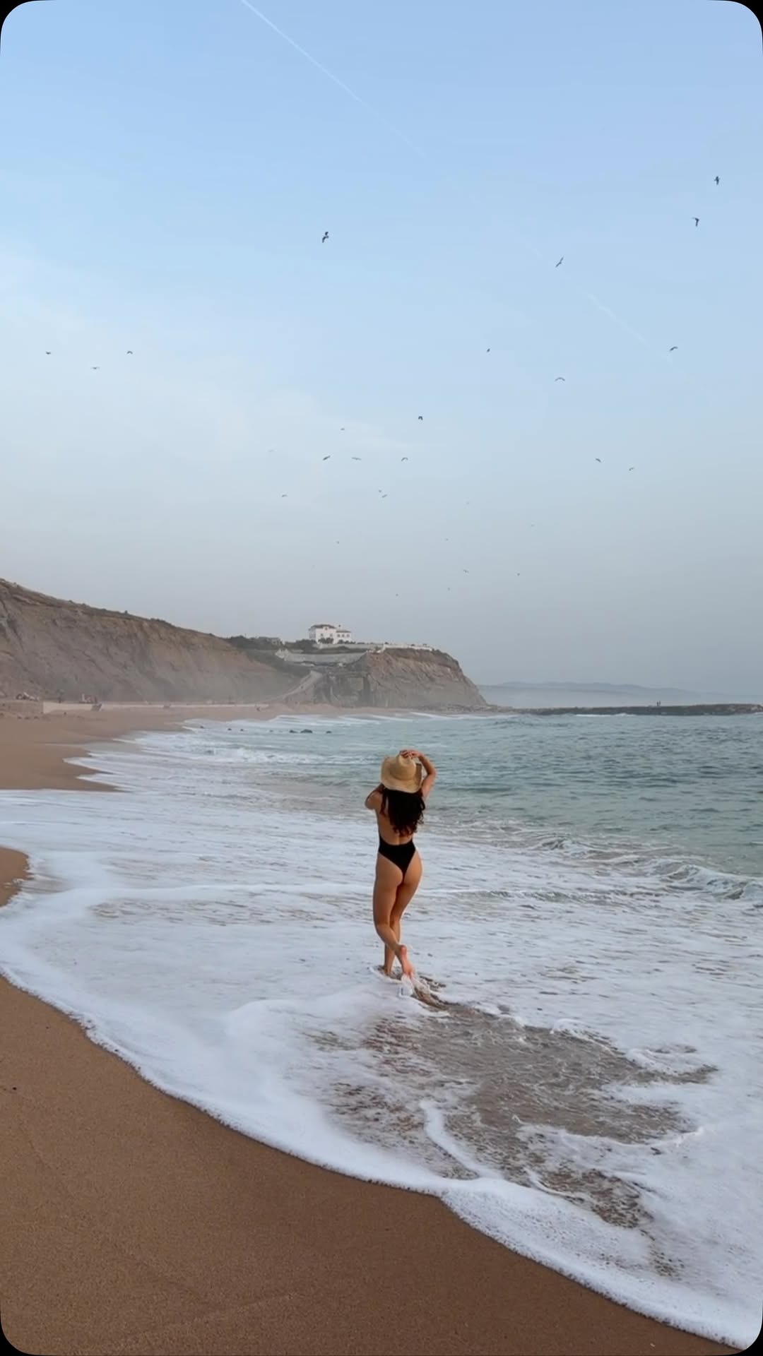 Monday Swimwear Black One-Piece Swimsuit and Straw Hat