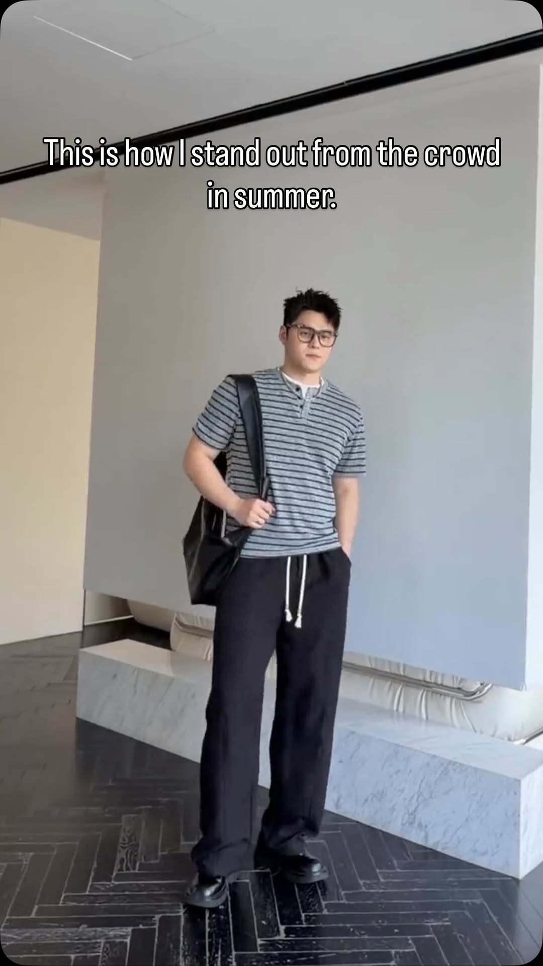 casual grey and black striped, solid black Henley t-shirt and wide-leg pants — short-sleeve, button placket Henley neckline, wide-leg, drawstring waist, white drawstrings