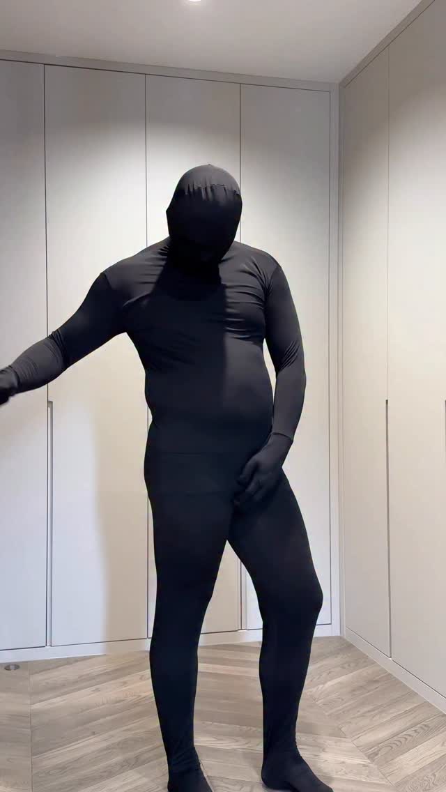 costume black full body suit — integrated gloves, integrated socks, hood covering face, seamless design