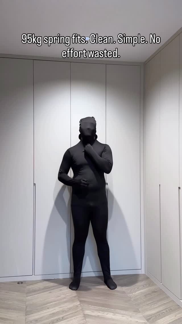 minimalist black bodysuit — full coverage, long sleeves, attached gloves, attached feet, integrated hood/mask