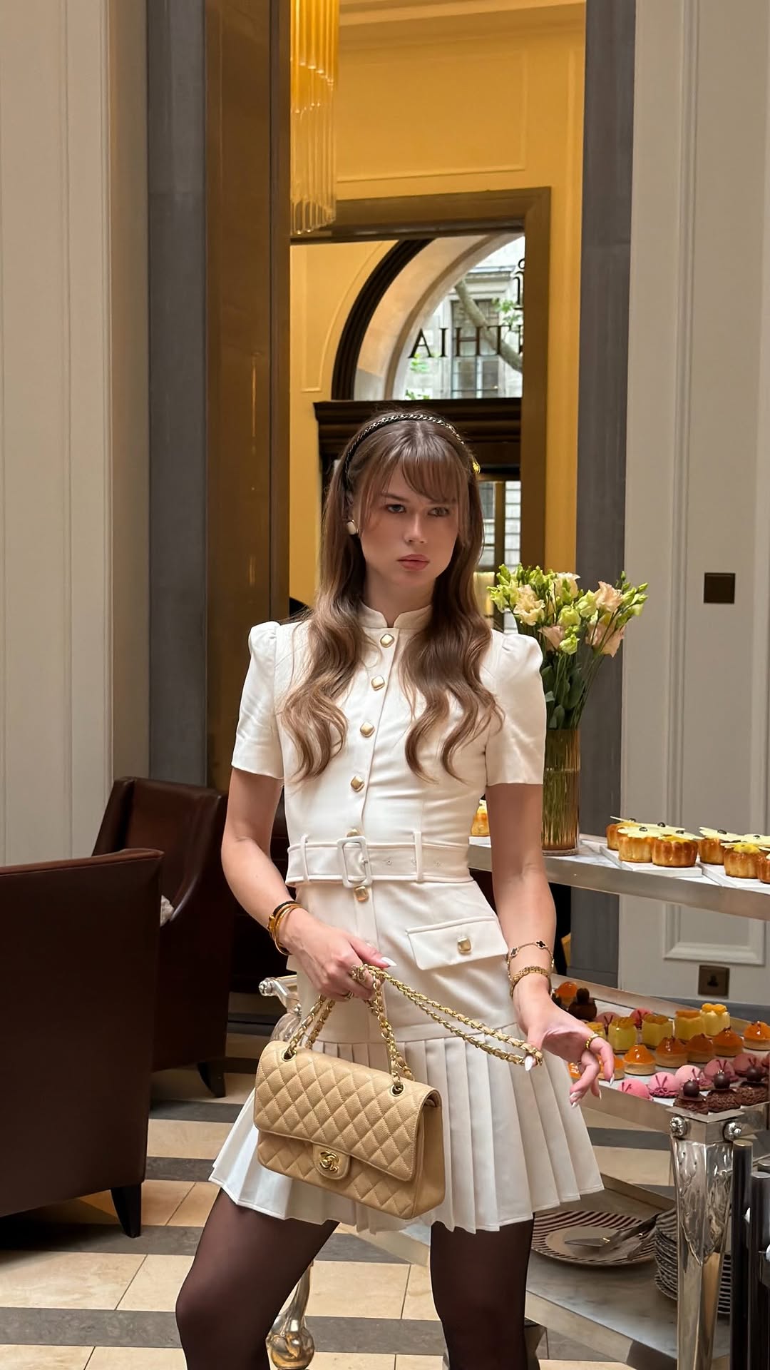 Chanel White belted pleated mini dress with quilted handbag